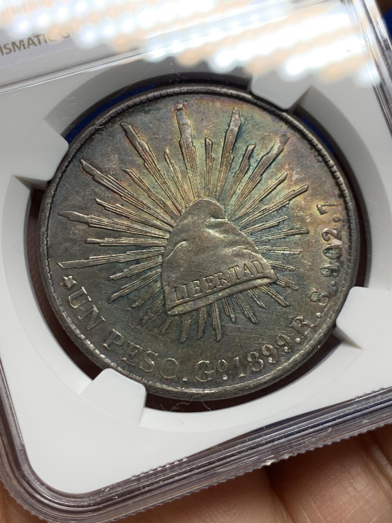 《竞宝斋》第462场 周日，周一，2场连拍 （全场包邮）欢迎送拍 NGC AUD 墨西哥1899年GORS版比索银币，五彩转光，非常漂亮的彩和状态，不理解为啥没分，可以尝试重评