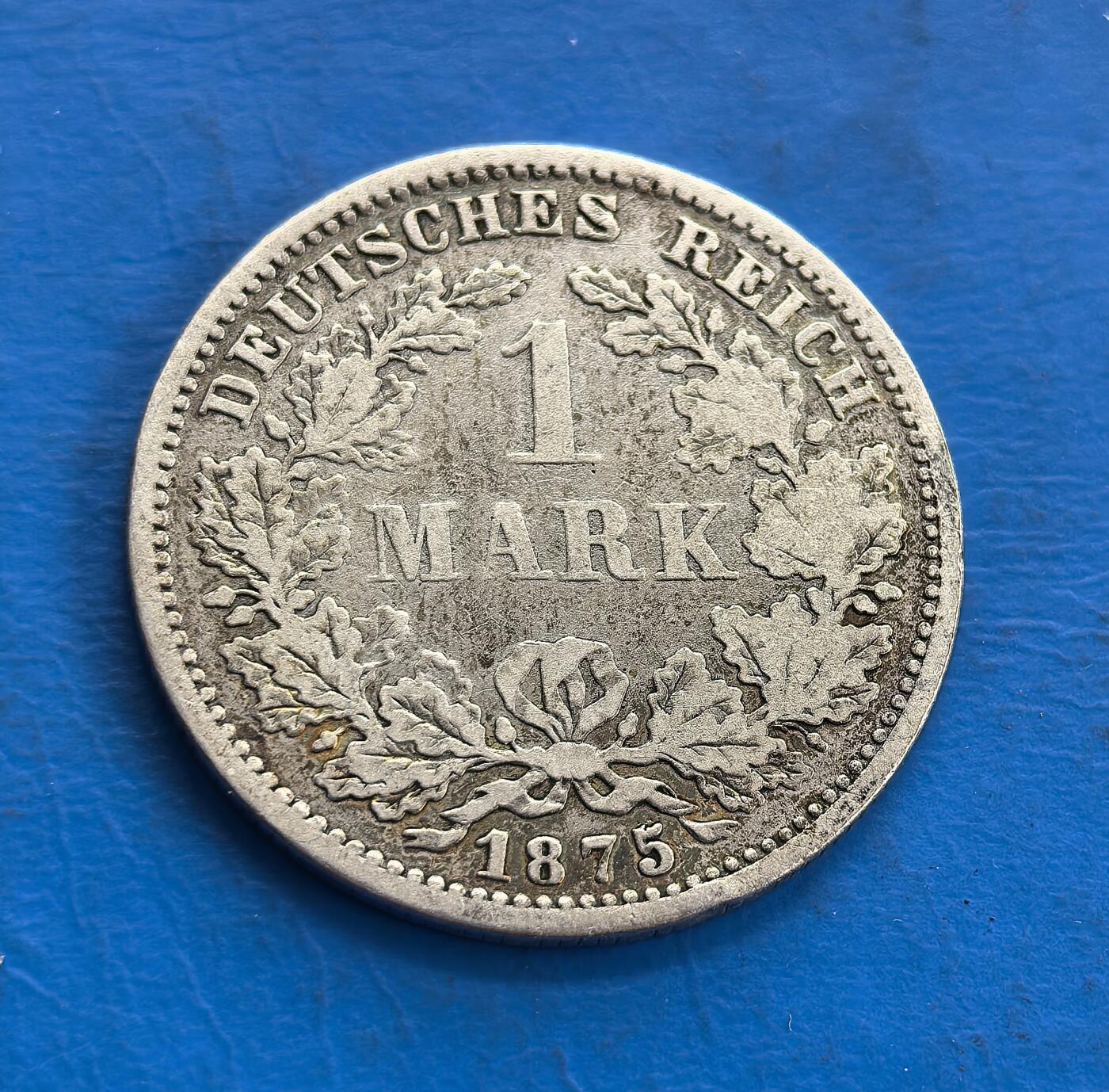 外国优质老铜币高银银币，周六九点倒数截拍，满百包邮，持续收拍 1875 年德意志帝国1马克银币，正面以 “1 MARK” 为核心，橡叶花环环绕，象征国家稳固；背面是德意志帝国国徽双头鹰纹，细节繁复庄重，见证了德国统一初期的货币体系，兼具历史价值与工艺美感。