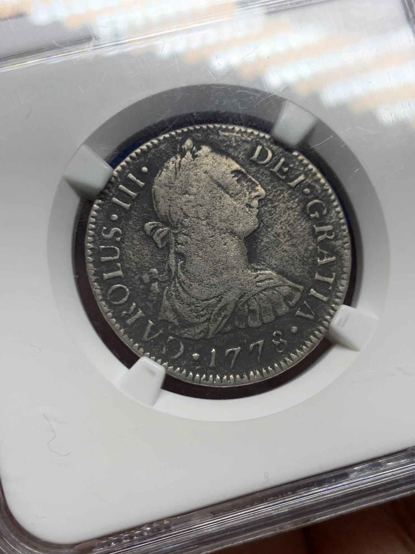 《竞宝斋》第462场 周日，周一，2场连拍 （全场包邮）欢迎送拍 NGC评级 西属墨西哥1778卡三银币2R，来自决定美国路易斯安那州命运的沉船—猎人号，这艘船的海捞币中小面值2R比8R少见的多，外拍热门品种国内少见，竞宝斋同品种海捞币曾有1300的成交纪录