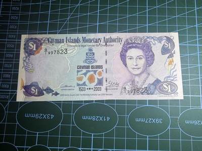 【炜奕收藏】，第五十八期，英属第三场 - 2003年开曼群岛1元纪念钞，UNC品相，号码无4