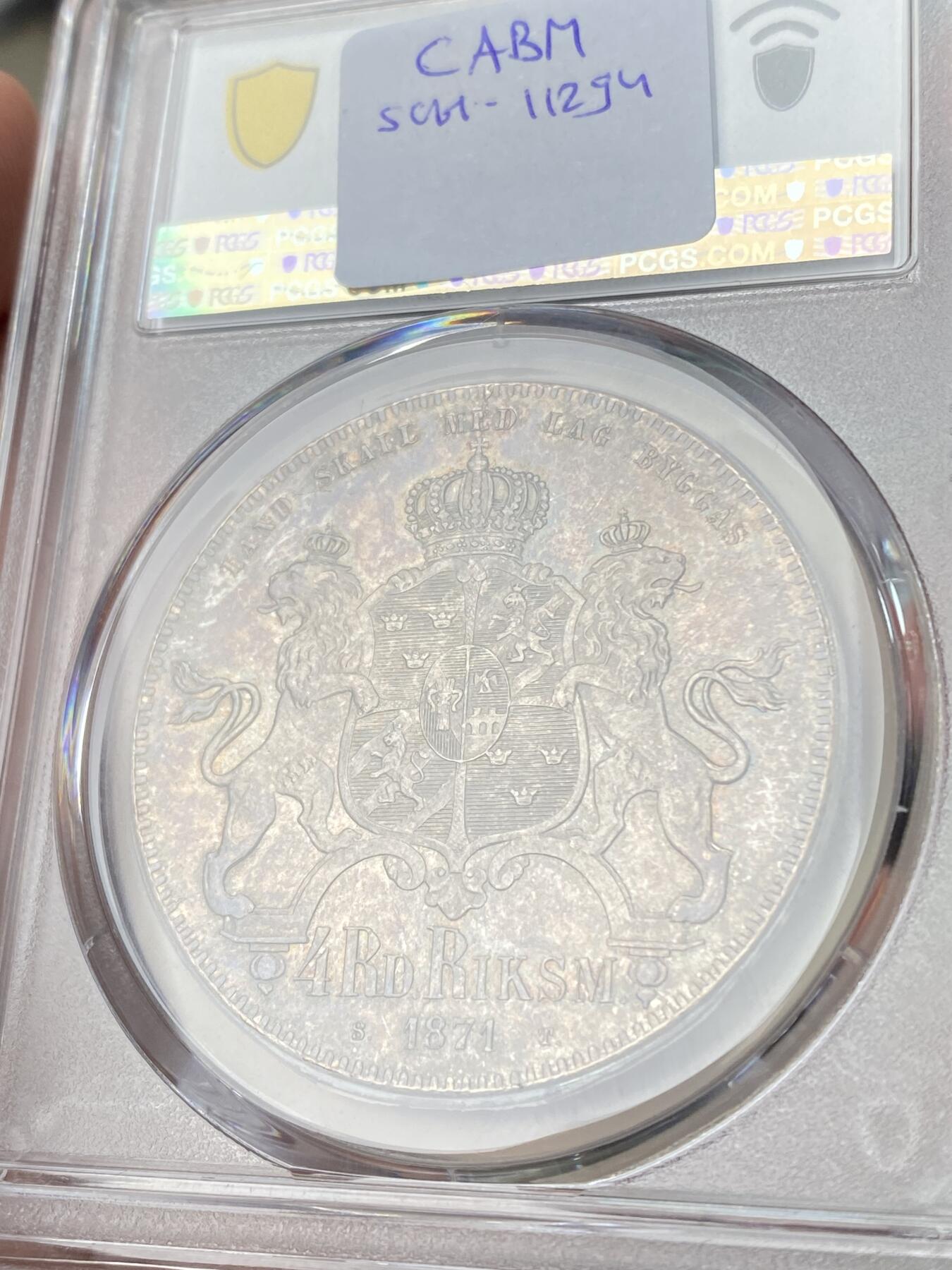 万国钱币拍卖第060期（万国六十期纪念大拍） PCGS MS64 1871瑞典卡尔十五世双狮4达勒大银 好品罕见的北欧大银主币 双狮护盾的纹章设计也非常漂亮 原味转光欧陆五彩 PC唯一冠军分 洼地品种 顶级收藏品质