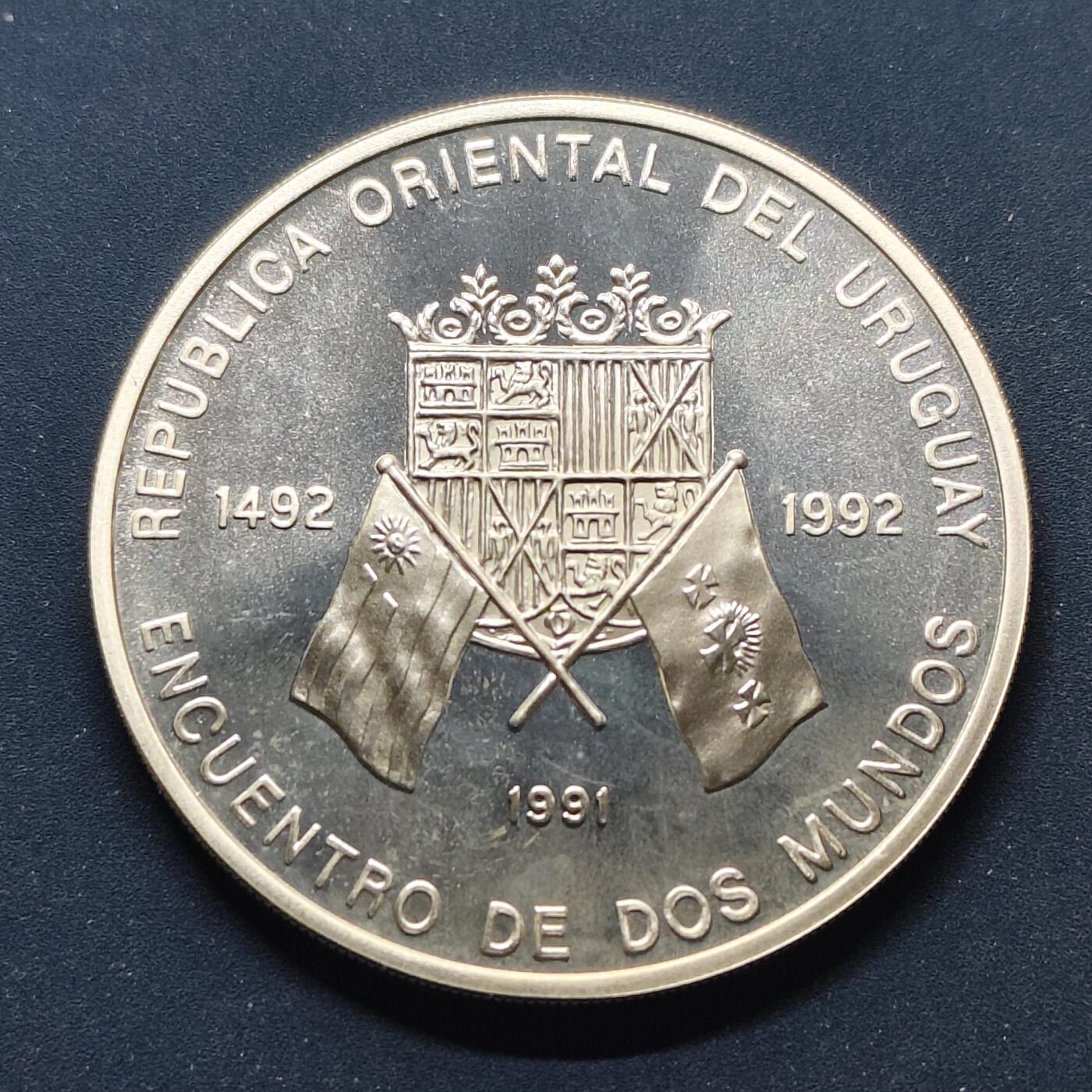 【全场包邮】纯粹捡漏拍499场-持续更新中 【伊比利亚美洲系列首套发现美洲500周年】乌拉圭1991年50000比索精制纪念银币【40毫米27克92.5%，估算纯银价约699元（按28元/克银价核算）】