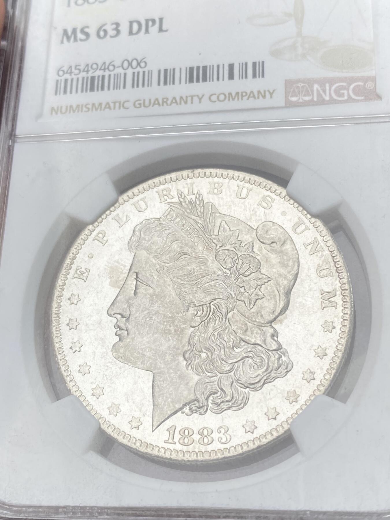 万国钱币拍卖第060期（万国六十期纪念大拍） NGC MS63DPL 1883O美国摩根女神一美元银币 罕见DPL评分 深度镜面喷砂类精制质感 顶级收藏品质