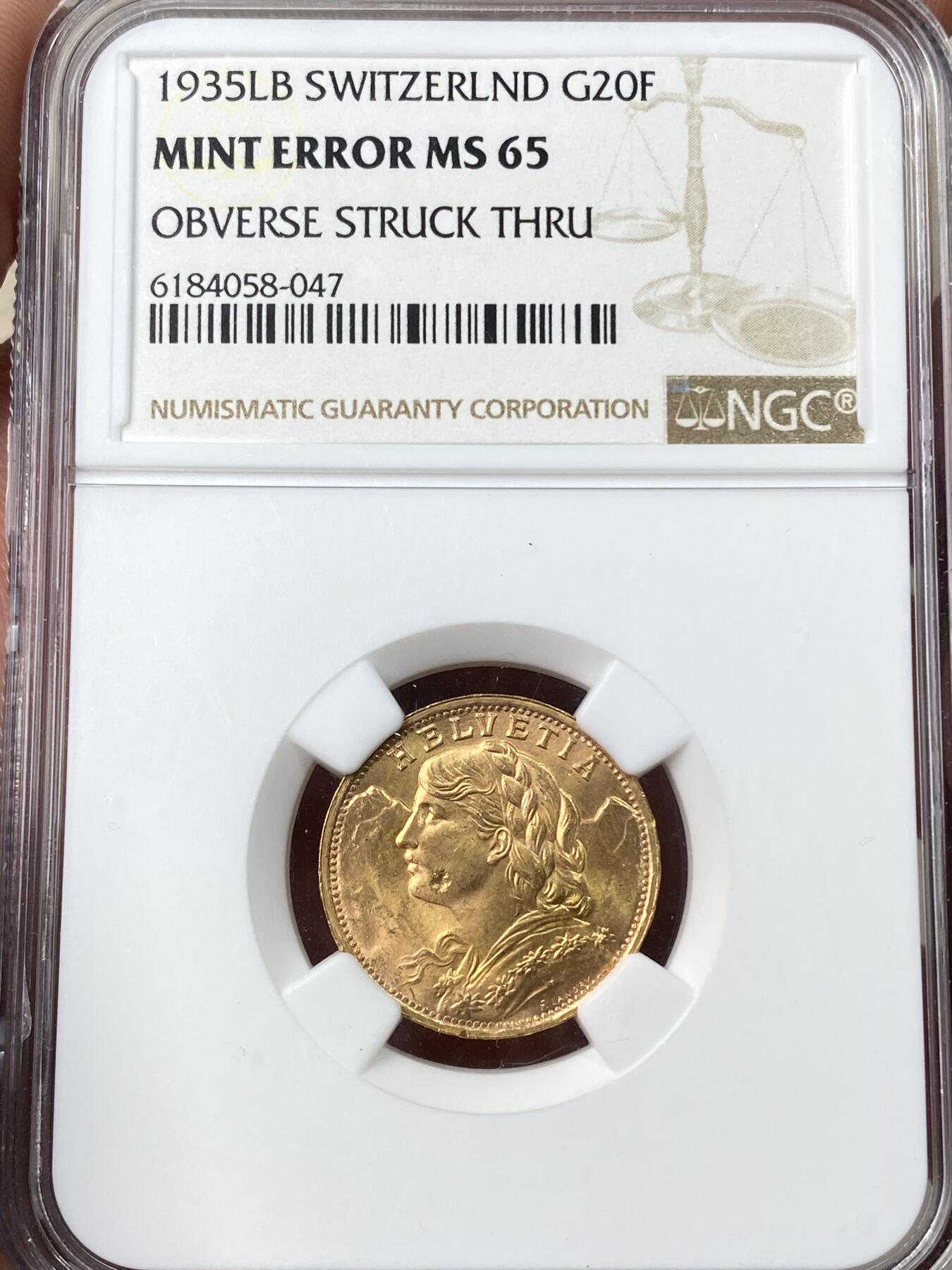 万国钱币拍卖第060期（万国六十期纪念大拍） NGC MS65 1935年年瑞士雪山女神20法郎金币 造币厂透打错版 BU品质丝滑金光收藏级 6.45G 900金