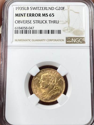 万国钱币拍卖第060期（万国六十期纪念大拍） - NGC MS65 1935年年瑞士雪山女神20法郎金币 造币厂透打错版 BU品质丝滑金光收藏级 6.45G 900金