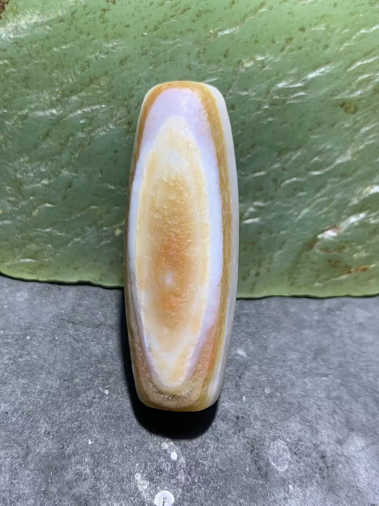 精美红白风化纹双天眼高玉化缠丝玛瑙桶珠一颗，