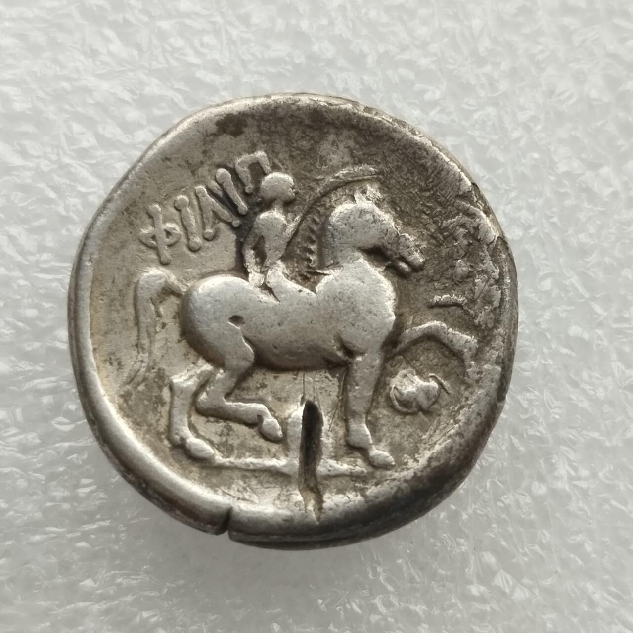 瓶子🏺第227期拍卖会 古希腊马其顿腓力二世宙斯4德大银币 公元前359—前336年 正面宙斯的桂冠面右头像 反面士兵手持棕榈叶向右骑马 重量13.91克  高浮雕艺术感好 有验银痕  