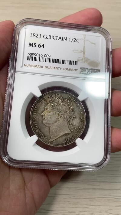 万国钱币拍卖第060期（万国六十期纪念大拍） NGC MS64 1821英国乔治四世三花半克朗 象征英格兰的玫瑰，苏格兰的蓟草和爱尔兰的三叶草三位一体的围绕在汉诺威王朝的盾徽周围 将乔治四世时期的装饰艺术体现的淋漓尽致  双面英式天鹅绒五彩 顶级典藏品质