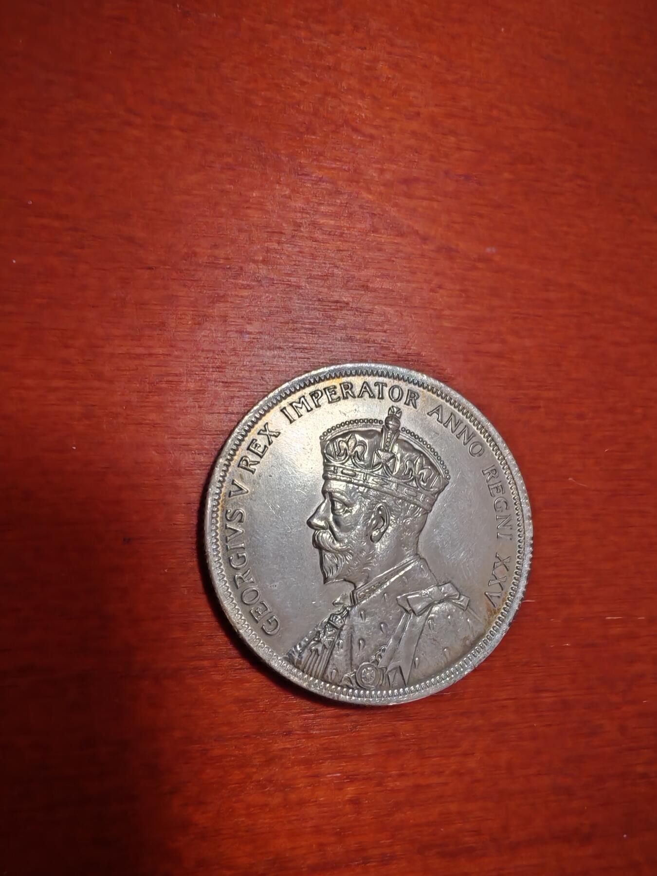 长老汇蛇年精选第九十七场拍卖  1935加拿大乔治五世独木舟1加元银币，独年份，23.33克800银，克书65分300美金