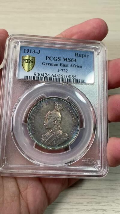 万国钱币拍卖第060期（万国六十期纪念大拍） PCGS MS64 1913德属东非威廉二世戎装1卢比银币 德属热门品种 高分极其难得 丝绸转光底板绚烂孔雀蓝彩环绕  PC唯二冠军