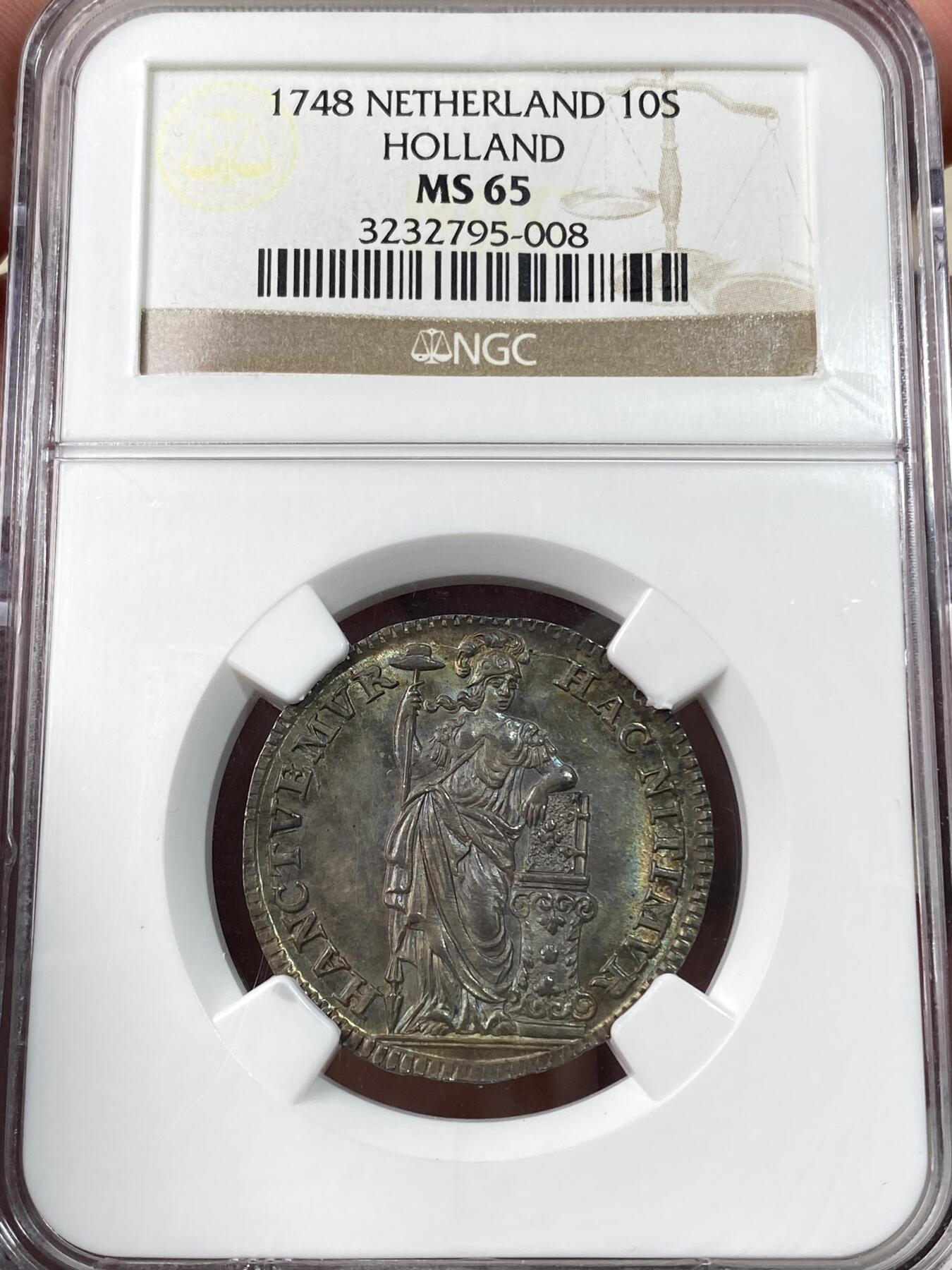 万国钱币拍卖第060期（万国六十期纪念大拍） NGC MS65 1748荷兰站人10S银币 全深打欧陆七彩裹身 NGC老盒顶级收藏品质