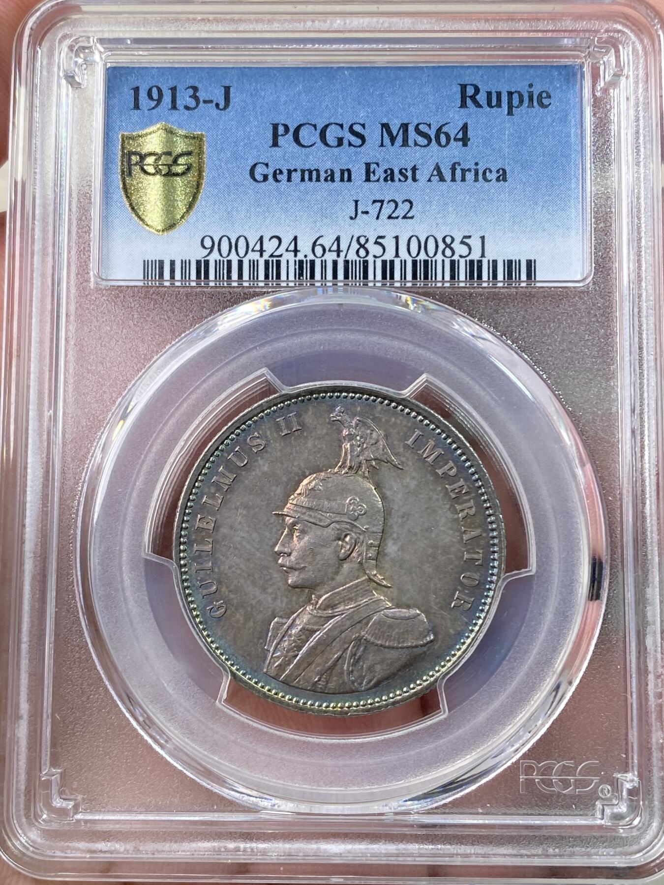 万国钱币拍卖第060期（万国六十期纪念大拍） PCGS MS64 1913德属东非威廉二世戎装1卢比银币 德属热门品种 高分极其难得 丝绸转光底板绚烂孔雀蓝彩环绕  PC唯二冠军