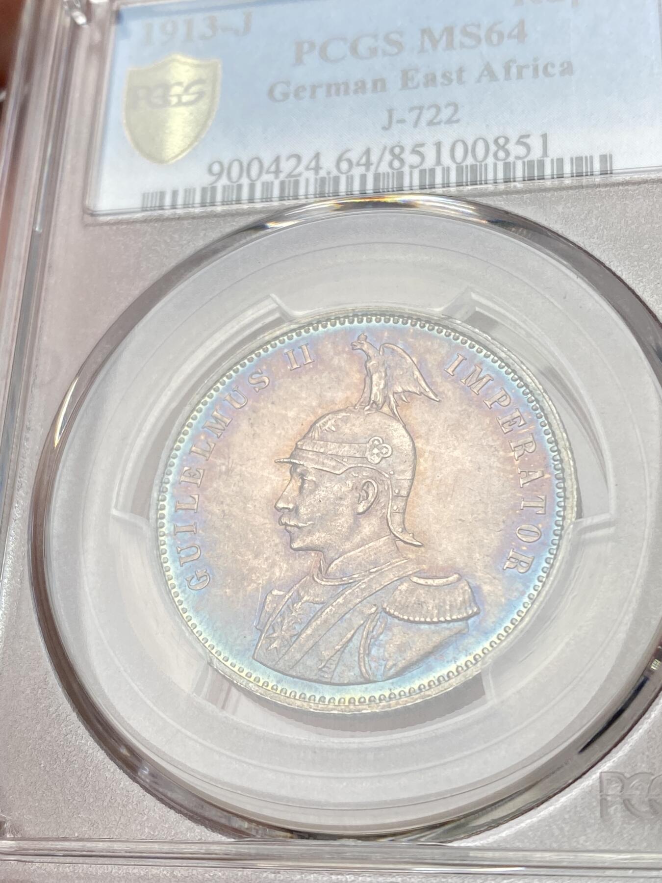 万国钱币拍卖第060期（万国六十期纪念大拍） PCGS MS64 1913德属东非威廉二世戎装1卢比银币 德属热门品种 高分极其难得 丝绸转光底板绚烂孔雀蓝彩环绕  PC唯二冠军