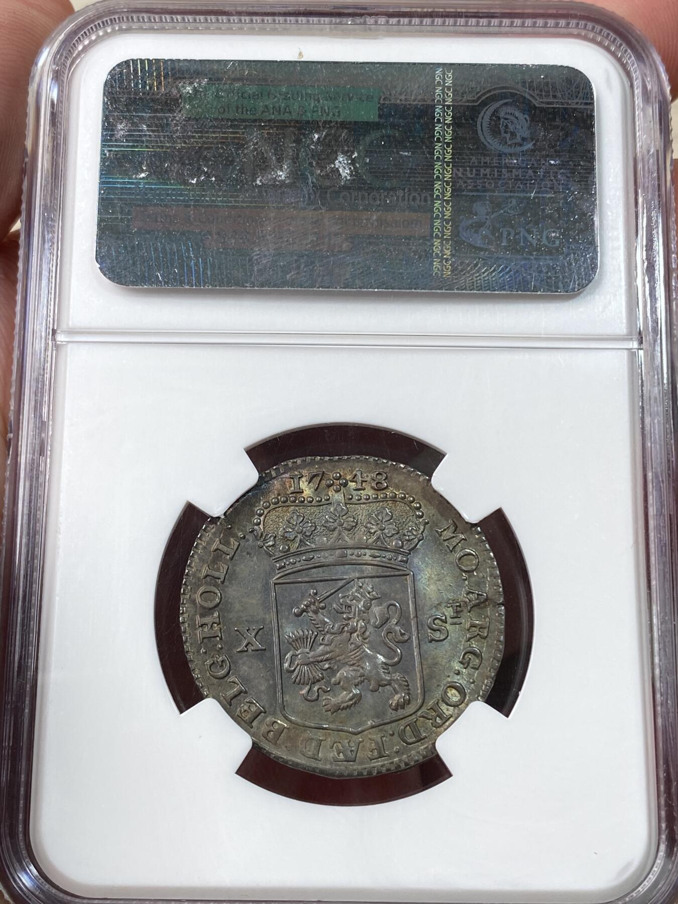 万国钱币拍卖第060期（万国六十期纪念大拍） NGC MS65 1748荷兰站人10S银币 全深打欧陆七彩裹身 NGC老盒顶级收藏品质