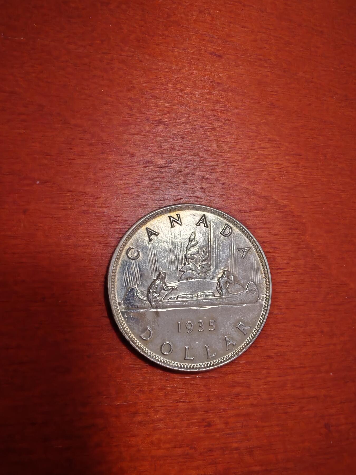 长老汇蛇年精选第九十七场拍卖  1935加拿大乔治五世独木舟1加元银币，独年份，23.33克800银，克书65分300美金