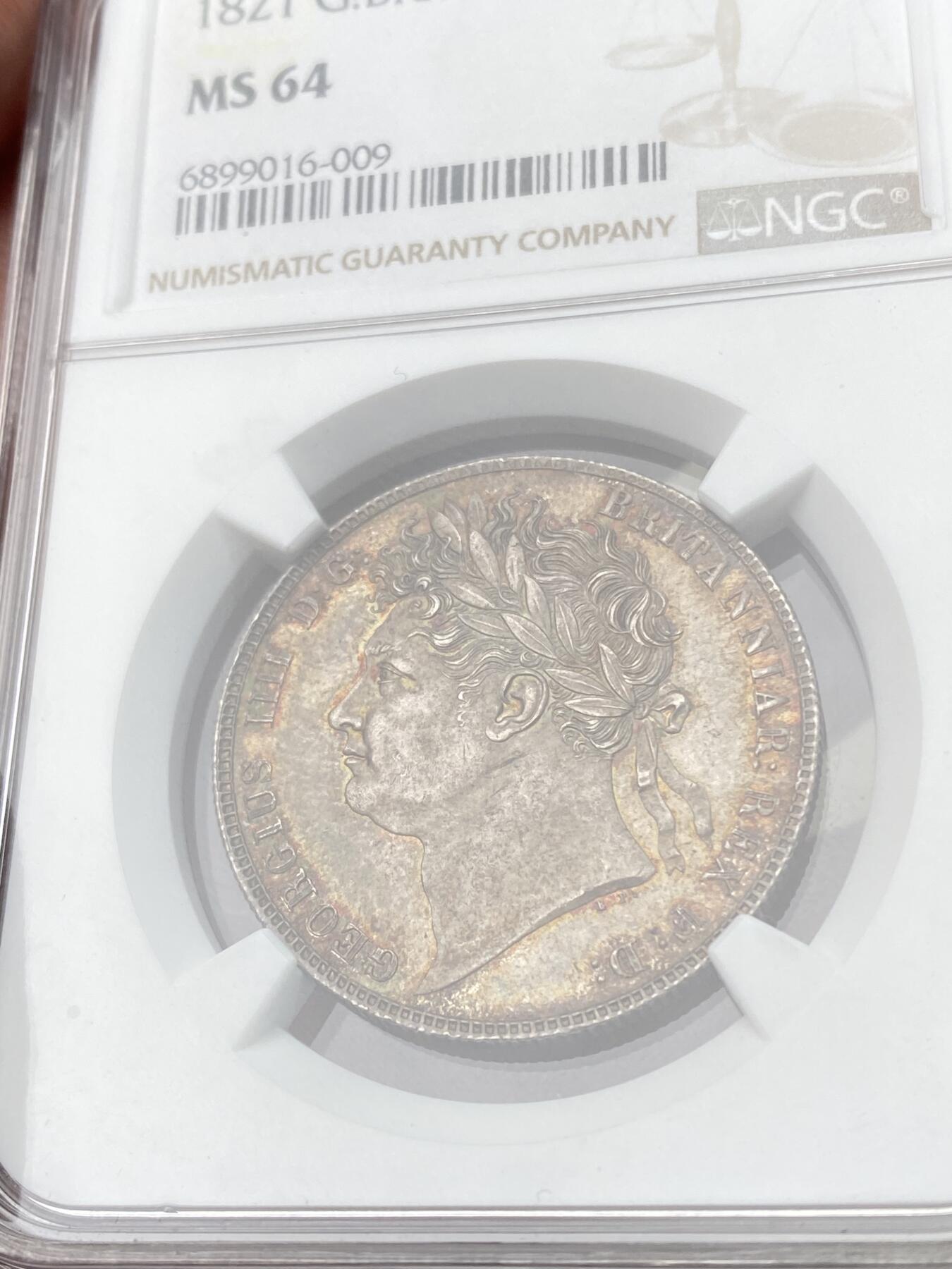 万国钱币拍卖第060期（万国六十期纪念大拍） NGC MS64 1821英国乔治四世三花半克朗 象征英格兰的玫瑰，苏格兰的蓟草和爱尔兰的三叶草三位一体的围绕在汉诺威王朝的盾徽周围 将乔治四世时期的装饰艺术体现的淋漓尽致  双面英式天鹅绒五彩 顶级典藏品质