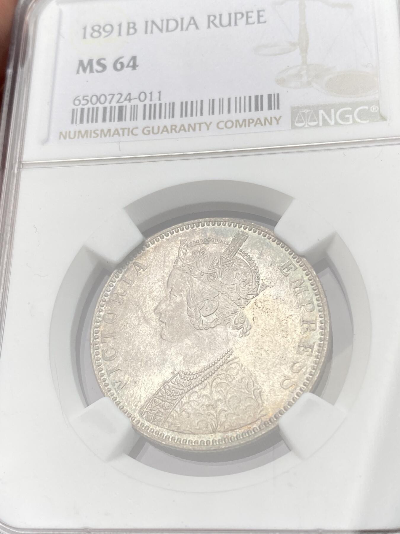 万国钱币拍卖第060期（万国六十期纪念大拍） NGC MS64 1891B英属印度维多利亚女王卢比银币 孟买厂铸造 全深打粉光五彩极美 观感远超分数的收藏级品质