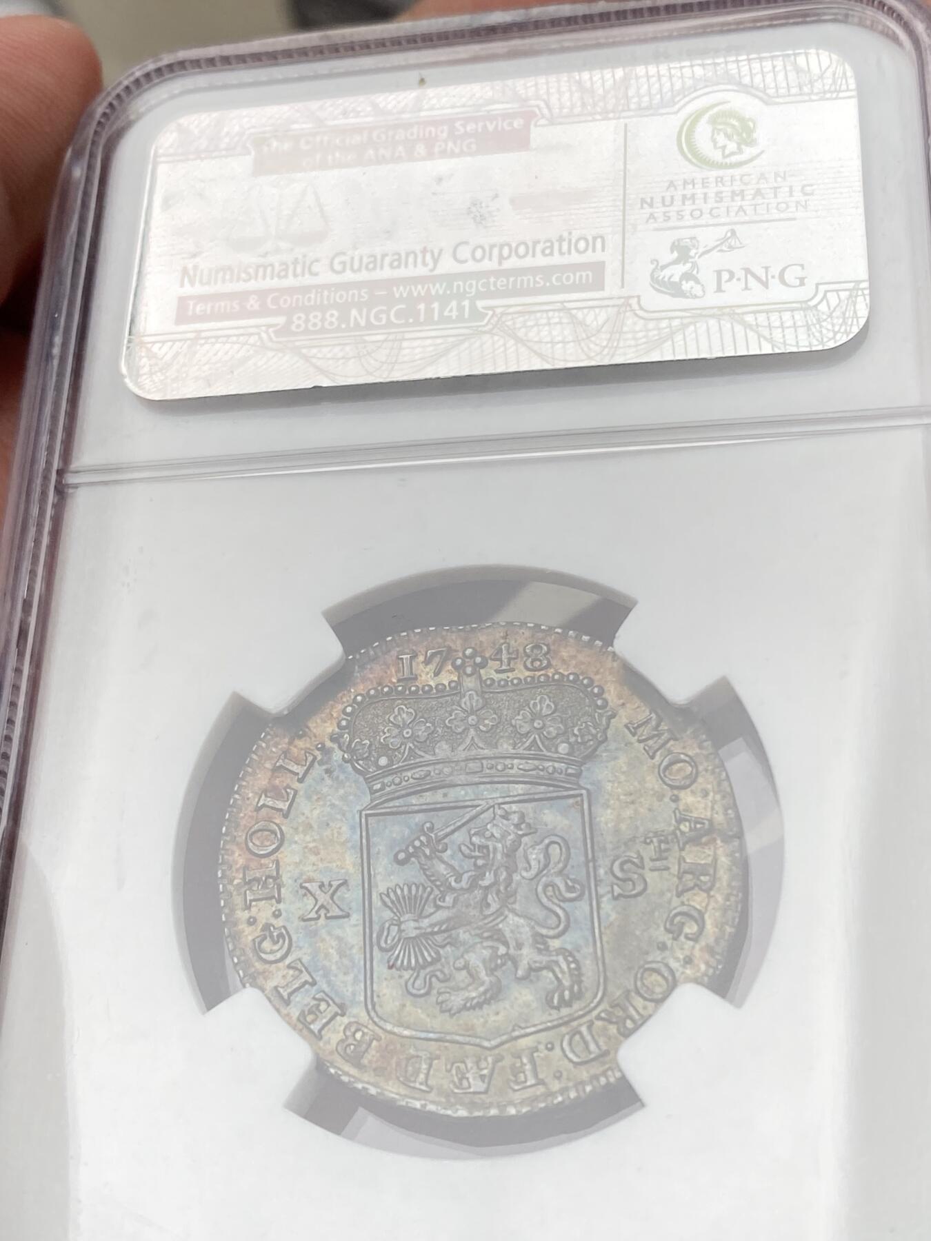 万国钱币拍卖第060期（万国六十期纪念大拍） NGC MS65 1748荷兰站人10S银币 全深打欧陆七彩裹身 NGC老盒顶级收藏品质