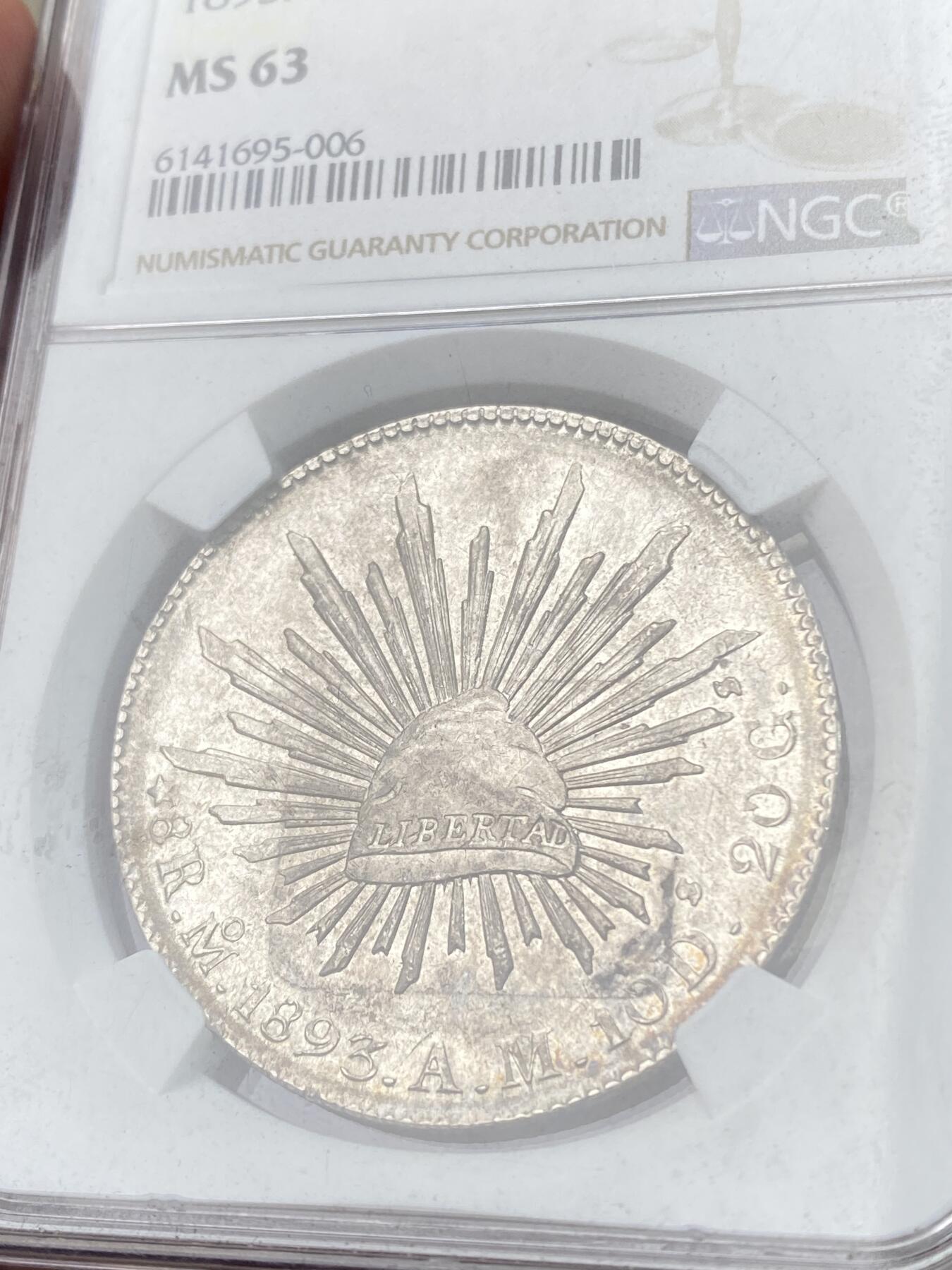 万国钱币拍卖第060期（万国六十期纪念大拍） NGC MS63 1893MO AM墨西哥花边鹰洋8R 原味香槟金淡彩银霜质感 打制深峻细节极佳