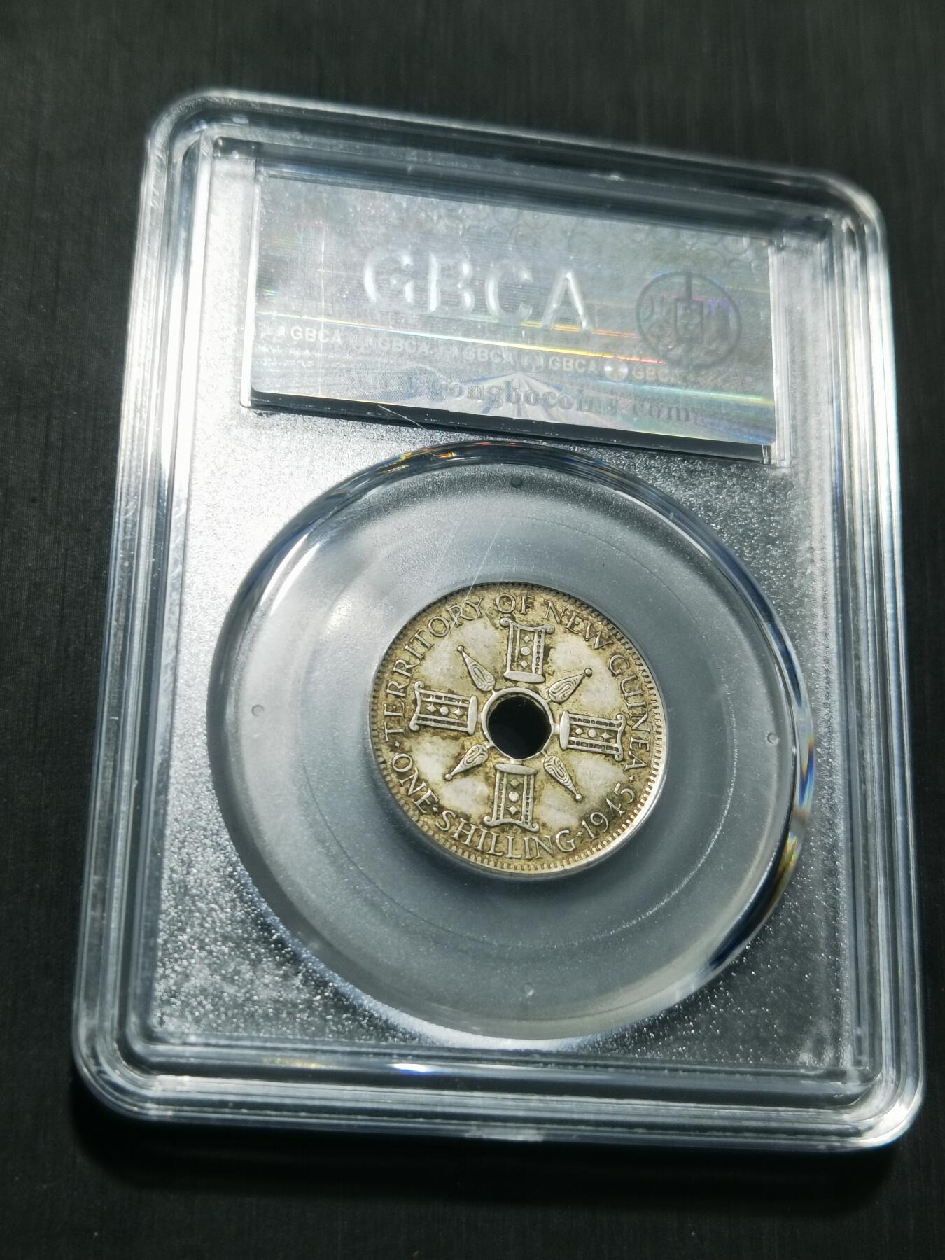 天下钱庄专场欢迎参拍 新几内亚中孔银币