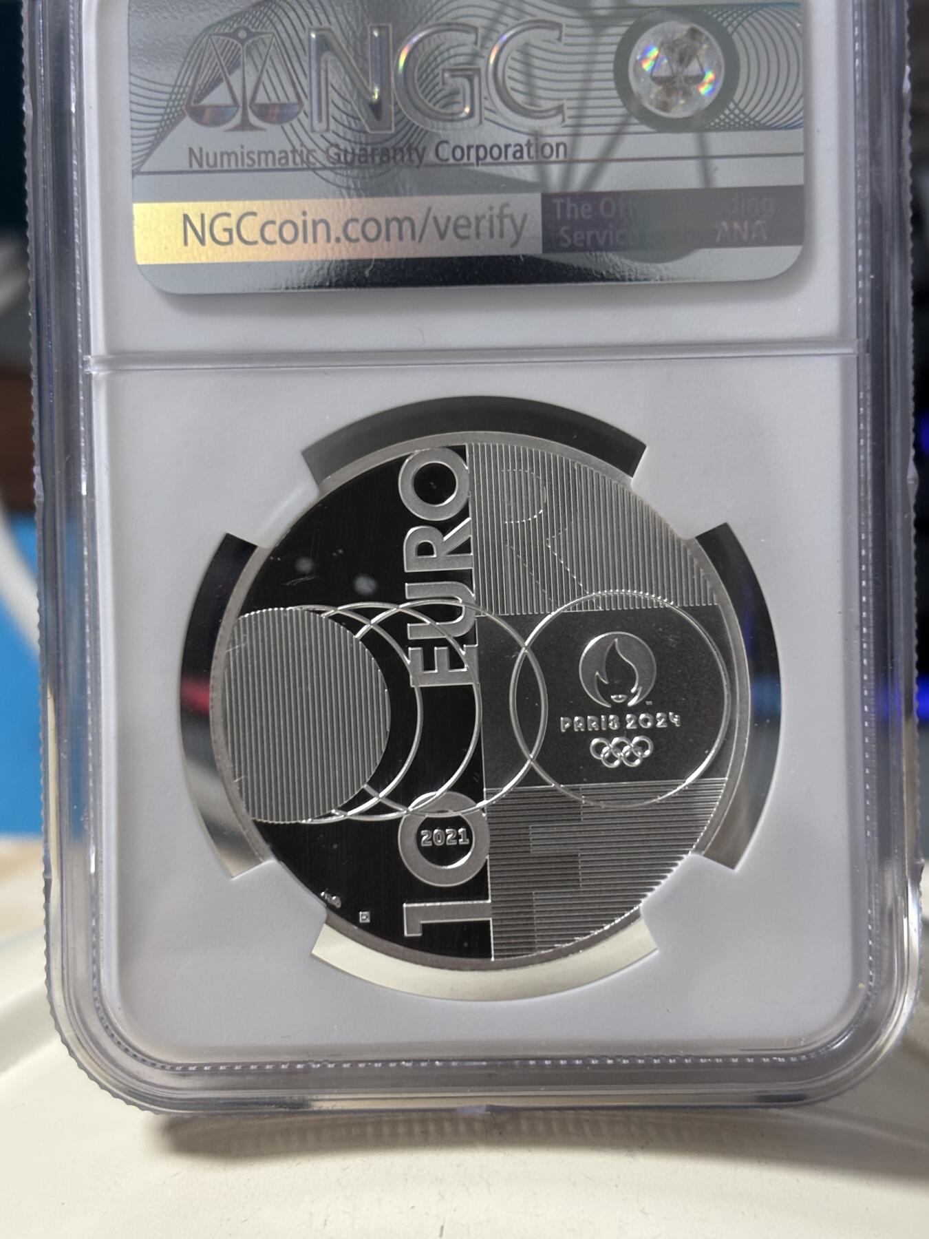 第190期拍卖 法国2021年东京到巴黎奥运交接纪念银币NGC-PF70首，22.2克，999银，发行30000枚，有白点