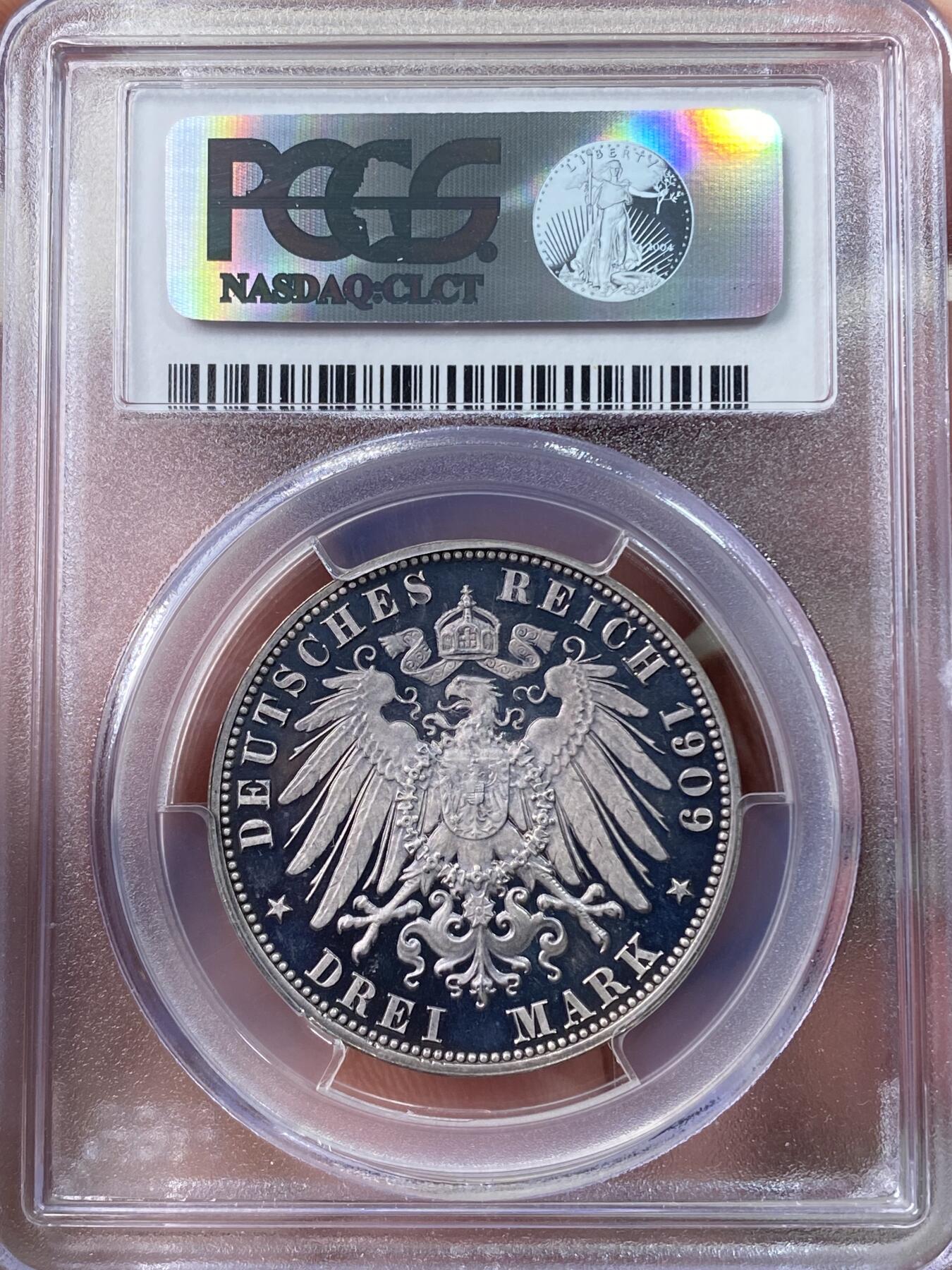 万国钱币拍卖第060期（万国六十期纪念大拍） PCGS PR64+DC 1909萨克森弗雷德里希·奥古斯特精制长翅3马克银币 超级深度镜面 所见最强喷砂 渐变紫罗兰五彩环绕 WINGS金标认证好状态 可遇不可求的顶级典藏品质