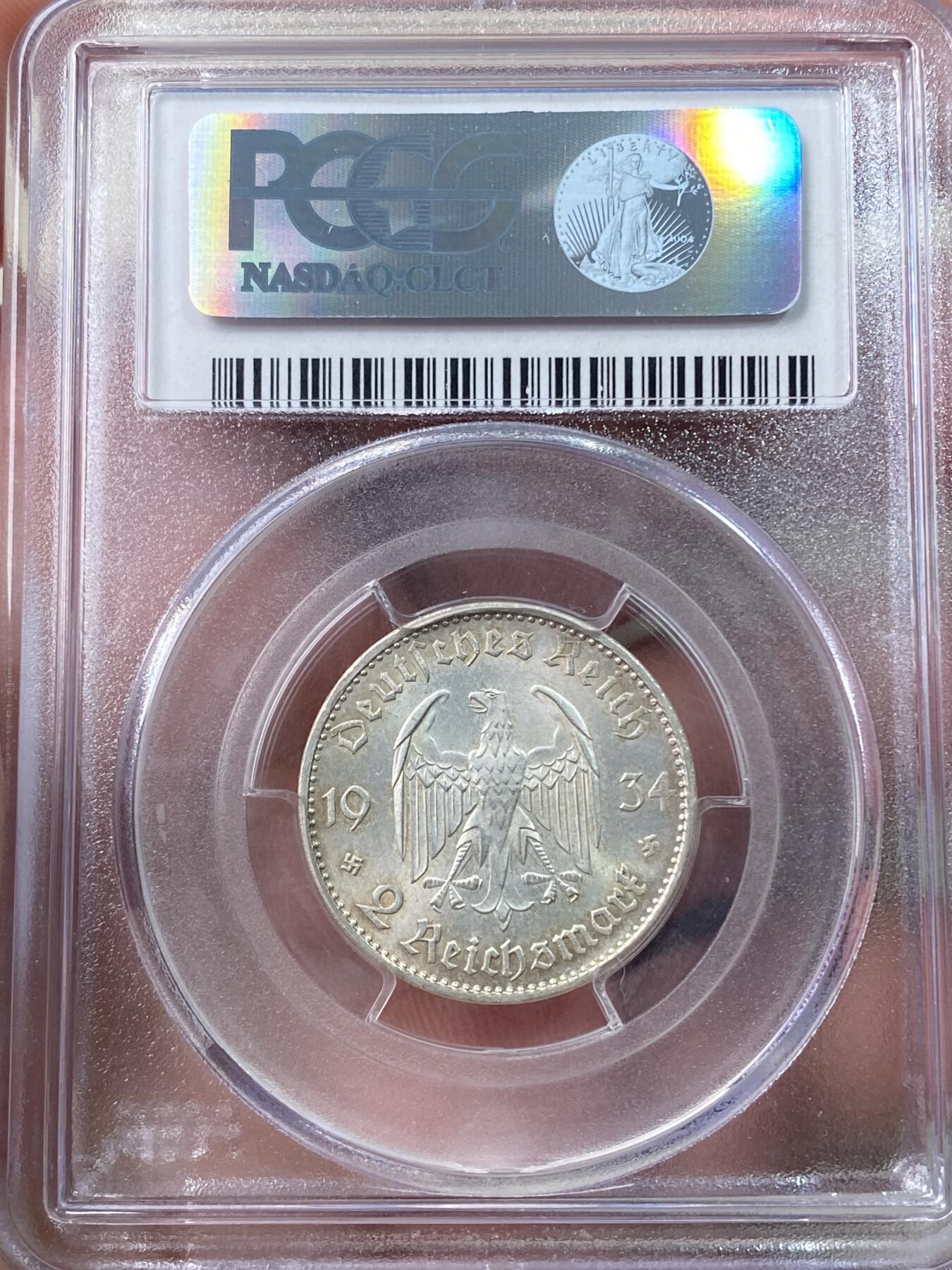 万国钱币拍卖第060期（万国六十期纪念大拍） PCGS MS64+ 1934德国社会主义工人党时期波茨坦教堂加字2马克 丝绸转光底板德式淡彩环绕 PC老评水晶盒品质保证