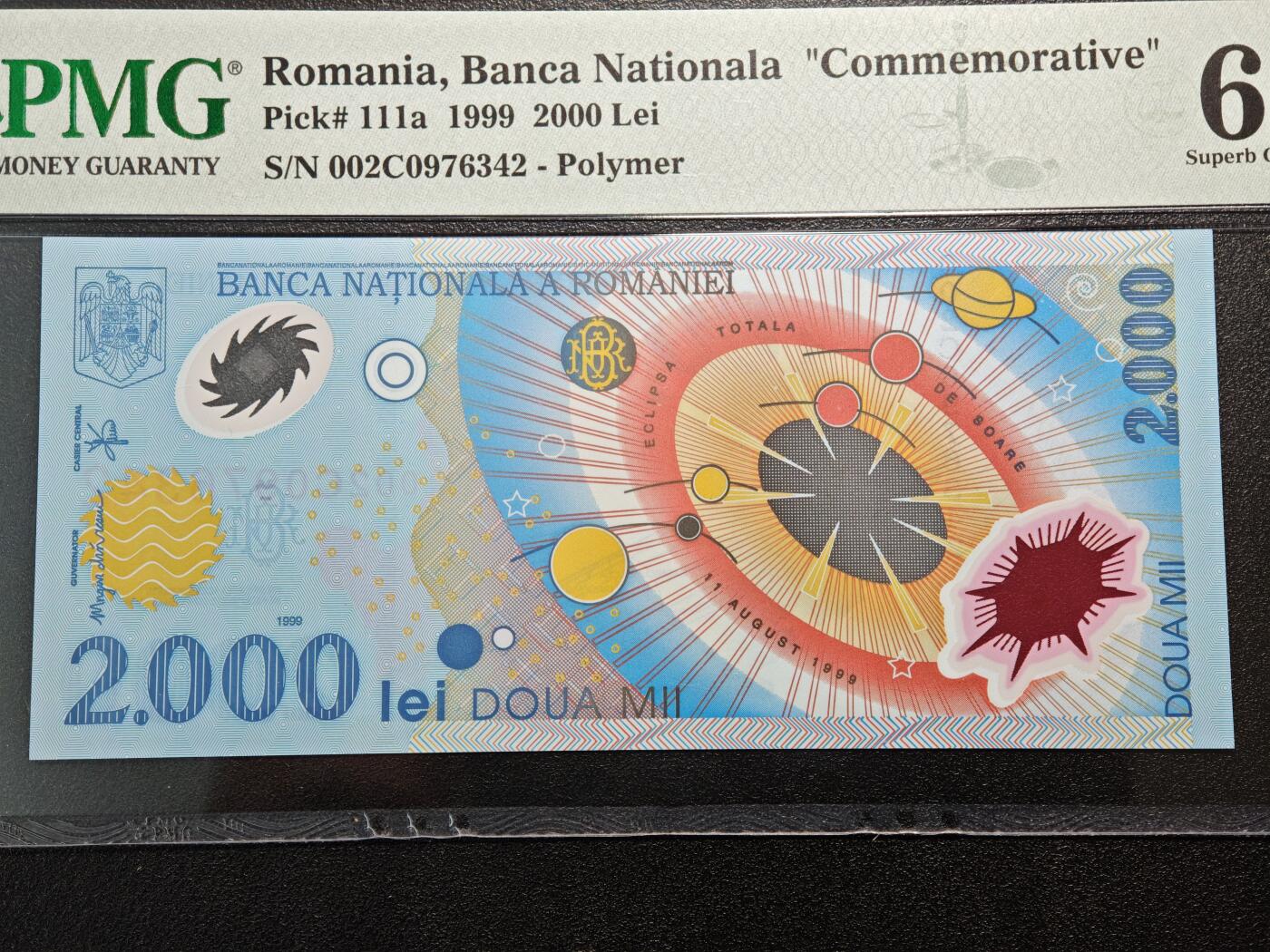 【德藏】世界币章拍卖第164期（拍品征集中~欢迎藏友联系） 1999年 罗马尼亚日全食2000雷塑料纪念钞 PMG 67EPQ