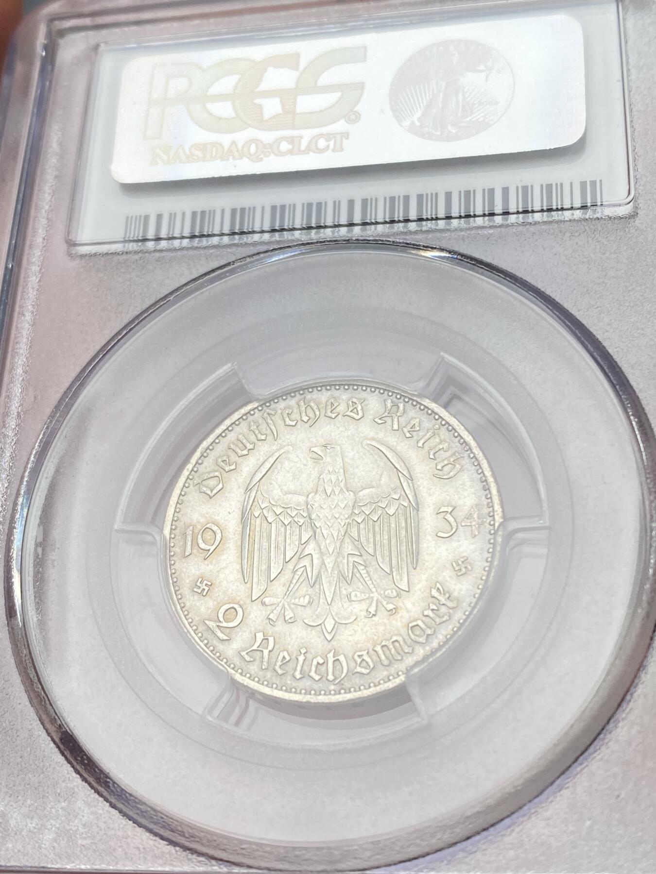 万国钱币拍卖第060期（万国六十期纪念大拍） PCGS MS64+ 1934德国社会主义工人党时期波茨坦教堂加字2马克 丝绸转光底板德式淡彩环绕 PC老评水晶盒品质保证