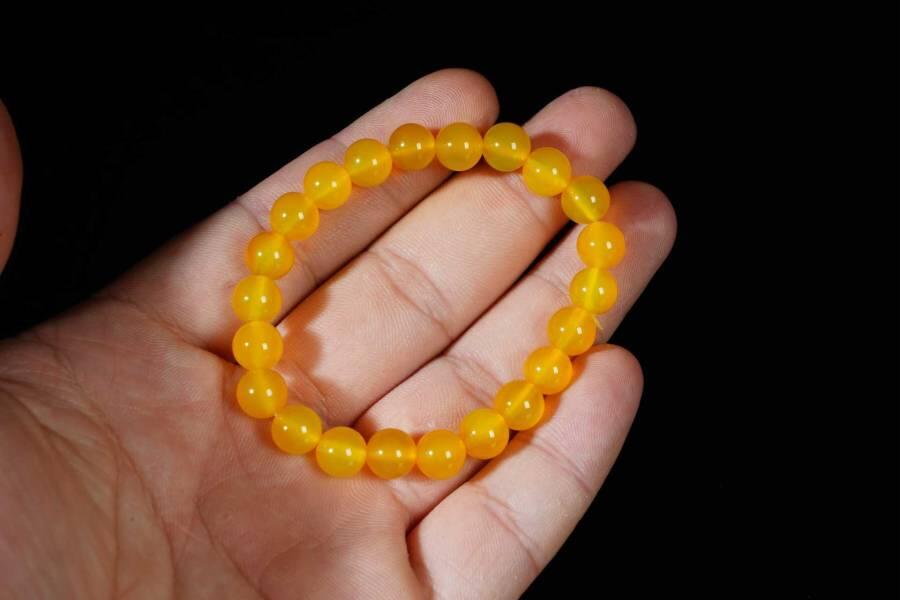 上海都达杂项专场十八（全场包邮） 天然黄玛瑙0.8圆珠手串 附鉴定证书