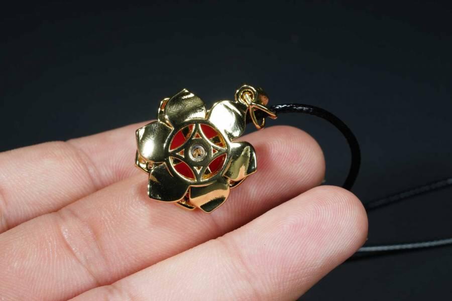 上海都达杂项专场十八（全场包邮） 天然镀金花朵嵌红玛瑙蛋面挂件（可转动）附鉴定证书、