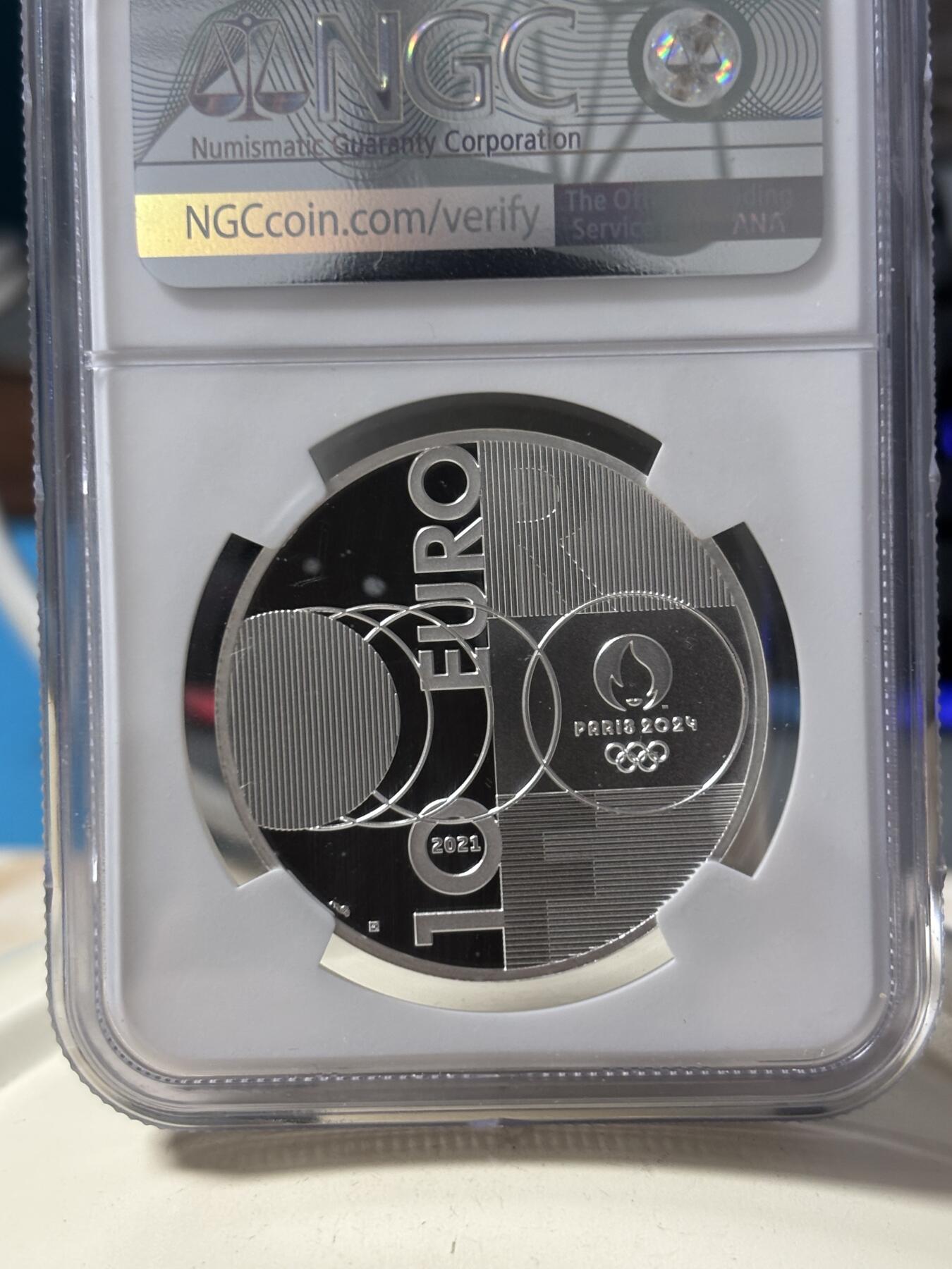 第190期拍卖 法国2021年东京到巴黎奥运交接纪念银币NGC-PF70首，22.2克，999银，发行30000枚，有白点