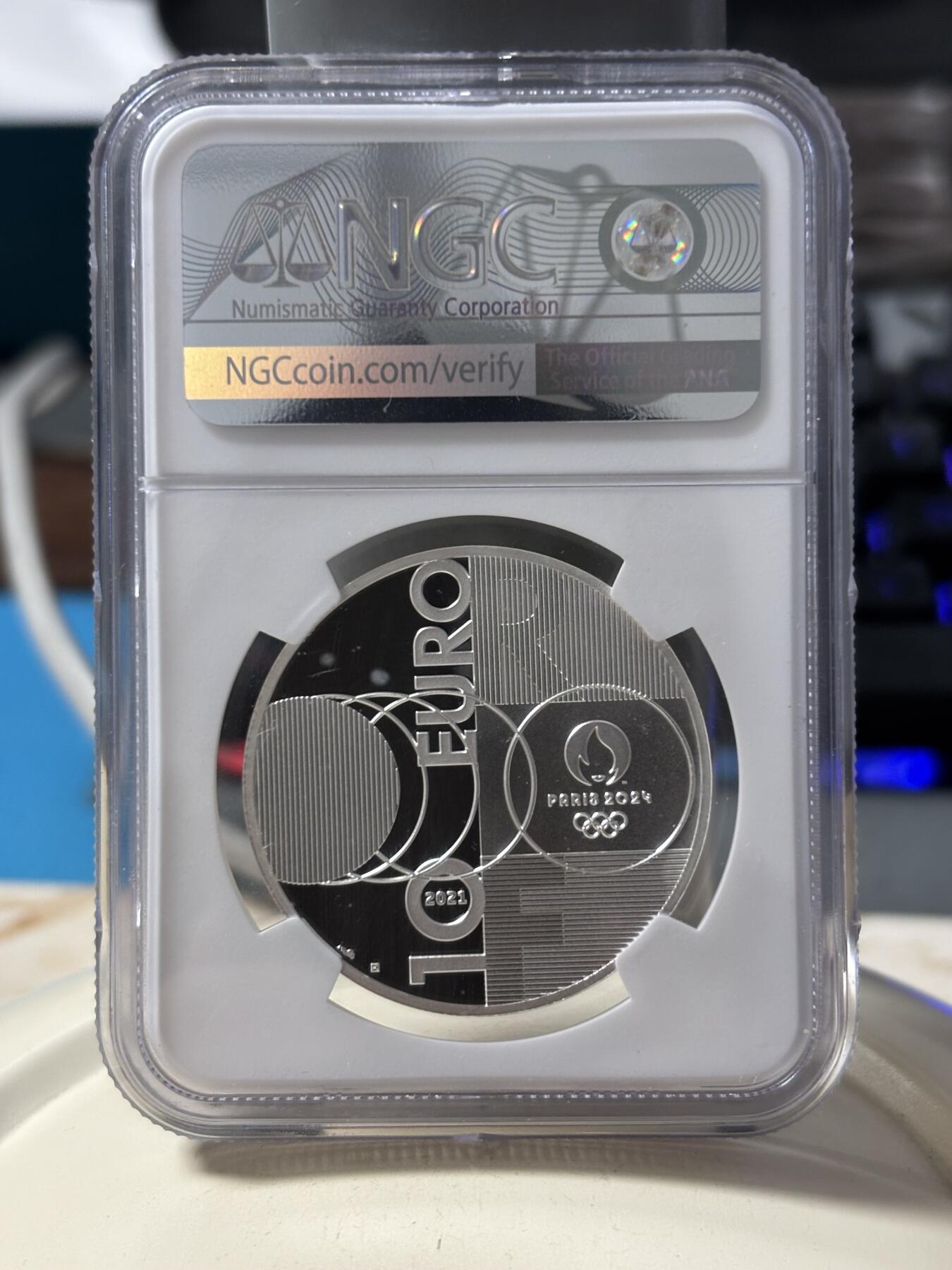 第190期拍卖 法国2021年东京到巴黎奥运交接纪念银币NGC-PF70首，22.2克，999银，发行30000枚，有白点