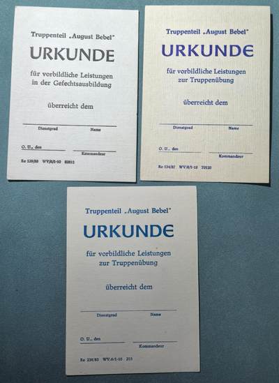 盛世勋华——号角文化勋章邮票专场拍卖第303期 - 东德人民军“奥古斯特·倍倍尔”部队训练演习模范表现空白证书 3张