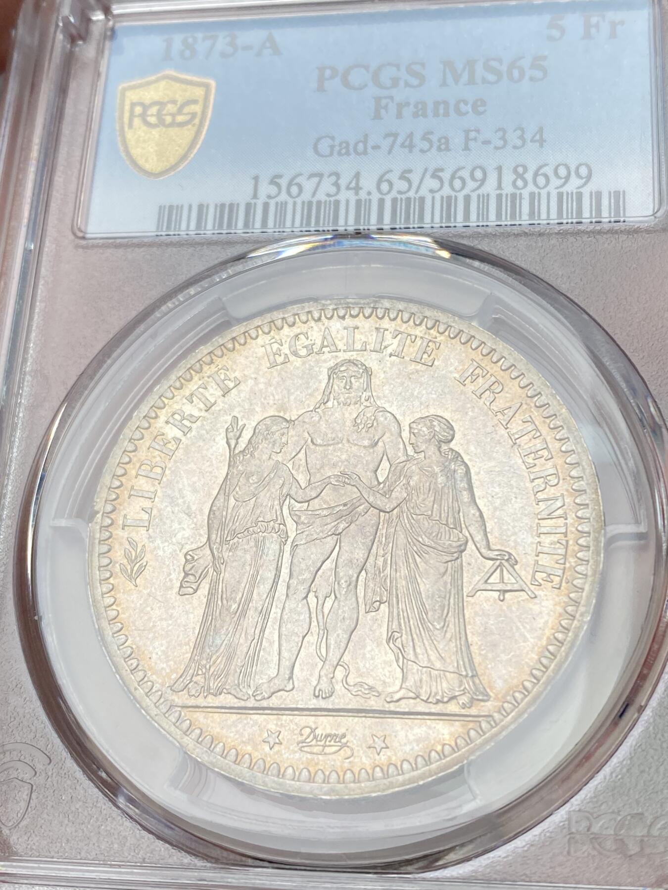 万国钱币拍卖第060期（万国六十期纪念大拍） PCGS MS65 1873法国大力神5法郎银币 经典品种 转光底板香槟金彩环绕 难得BU品质