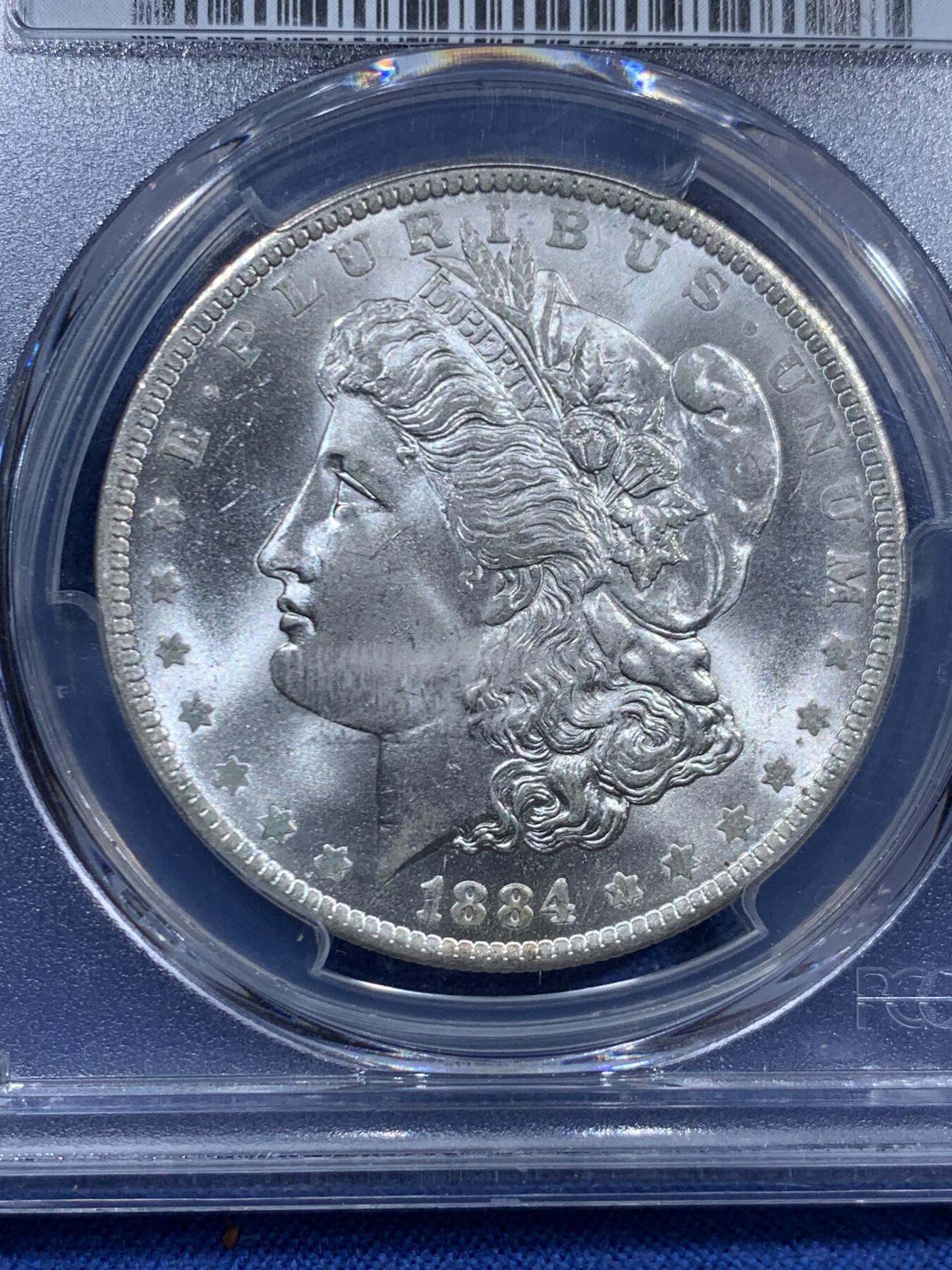 《竞宝斋》第463-465场 周日，周一，周二，3场连拍 （全场包邮）欢迎送拍 PCGS MS65+ 美国1884-O摩根银币 背面支撑有磕