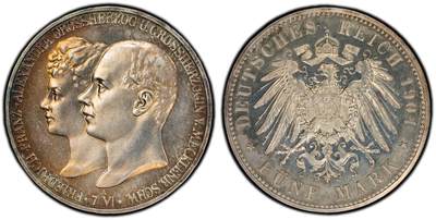 万国钱币拍卖第060期（万国六十期纪念大拍） - PCGS PR64 1904德国梅克伦堡-什未林皇家大婚精制纪念5马克 用以纪念弗里德里希·弗朗茨四世与汉诺威及坎伯兰的亚历山德拉公主的婚礼，发行量仅2500枚。耀眼的香槟色包浆如水彩般铺展于深度镜面的底板 顶级德式工艺 令人赏心悦目的收藏级品质