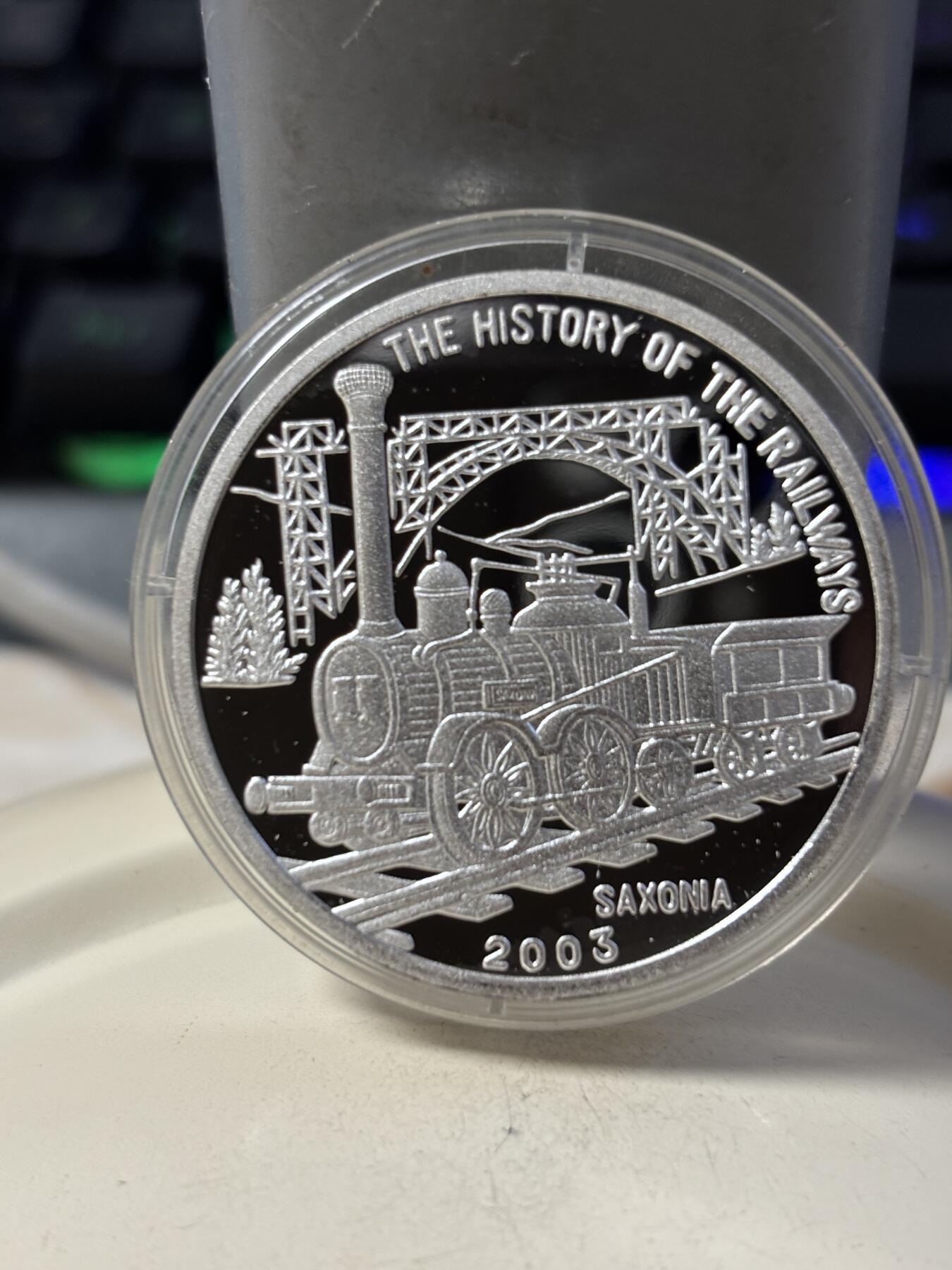 第190期拍卖 朝鲜2003年火车20克纪念银币2，999银