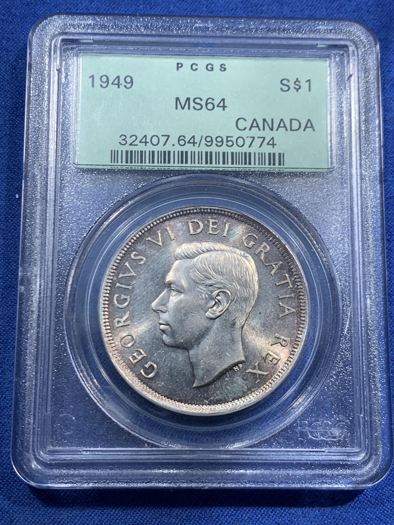 《竞宝斋》第463-465场 周日，周一，周二，3场连拍 （全场包邮）欢迎送拍 PCGS MS64 加拿大 1949年1DOLLAR帆船银币 原生状态，金橙色调主导的自然包浆使得局部泛现柔和虹彩，正背面细节锋利，轮廓清晰，非白币可比