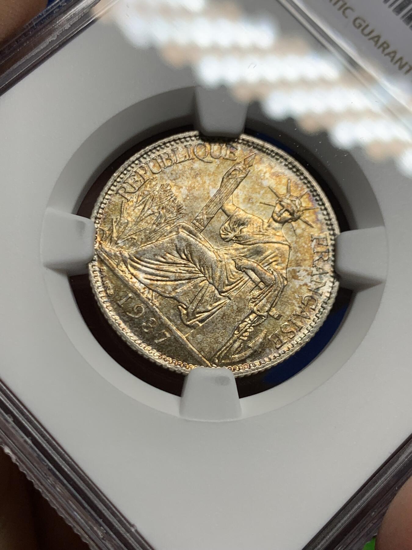 《竞宝斋》第463-465场 周日，周一，周二，3场连拍 （全场包邮）欢迎送拍 NGC MS62 法属印支1937年坐洋20分银币，夺目绚丽五彩，分数虽然一般但彩不错