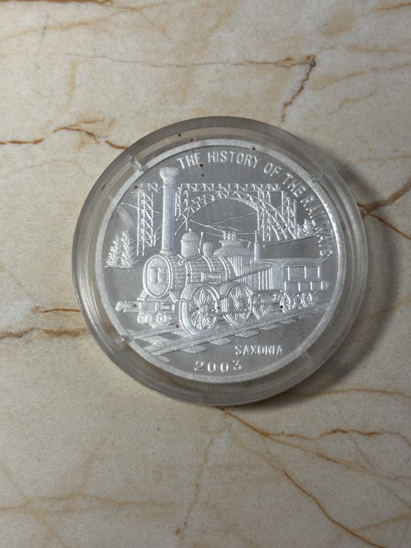 第190期拍卖 朝鲜2003年火车20克纪念银币2，999银