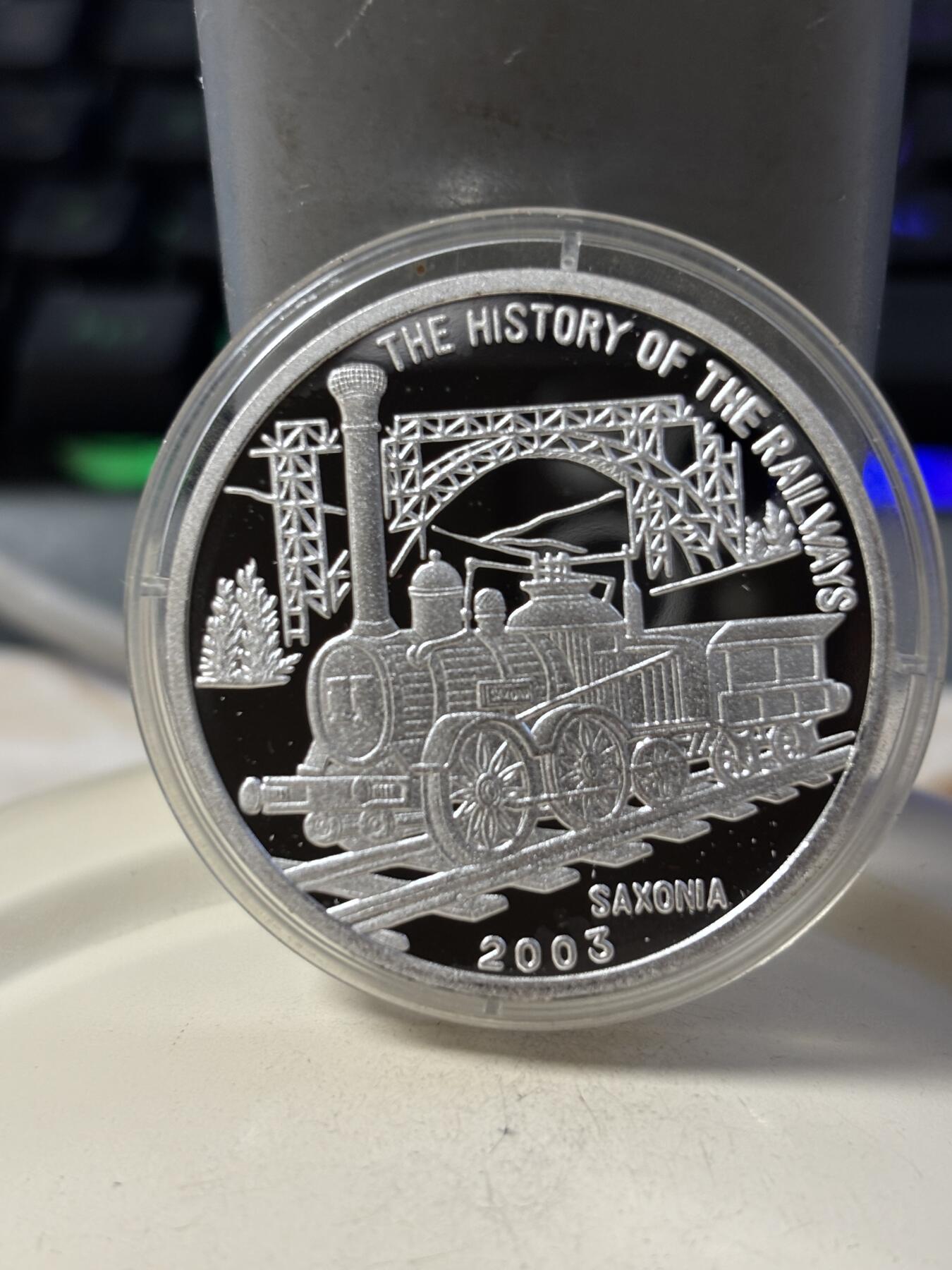 第190期拍卖 朝鲜2003年火车20克纪念银币2，999银