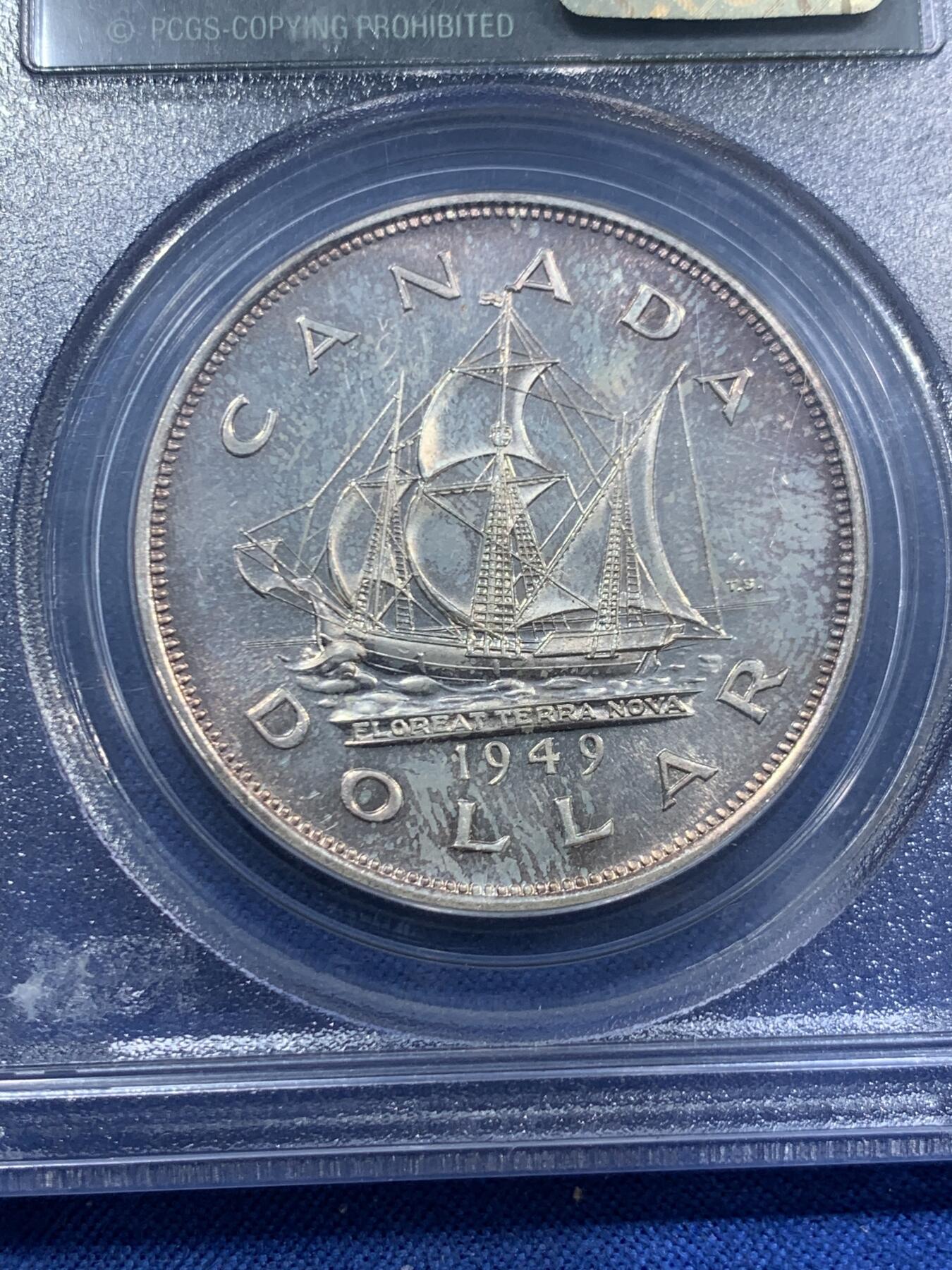 《竞宝斋》第463-465场 周日，周一，周二，3场连拍 （全场包邮）欢迎送拍 PCGS MS64 加拿大 1949年1DOLLAR帆船银币 原生状态，金橙色调主导的自然包浆使得局部泛现柔和虹彩，正背面细节锋利，轮廓清晰，非白币可比