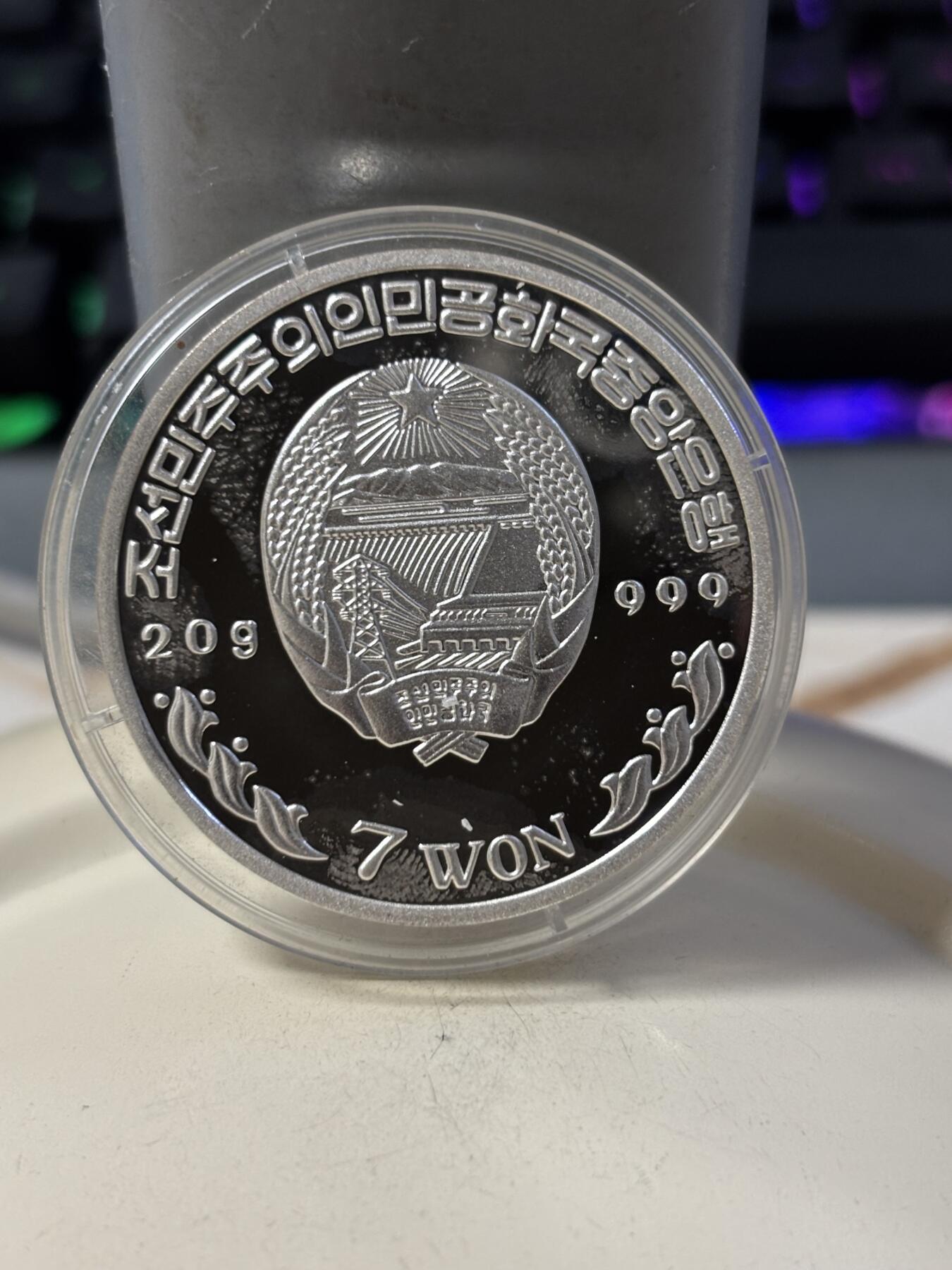 第190期拍卖 朝鲜2003年火车20克纪念银币2，999银