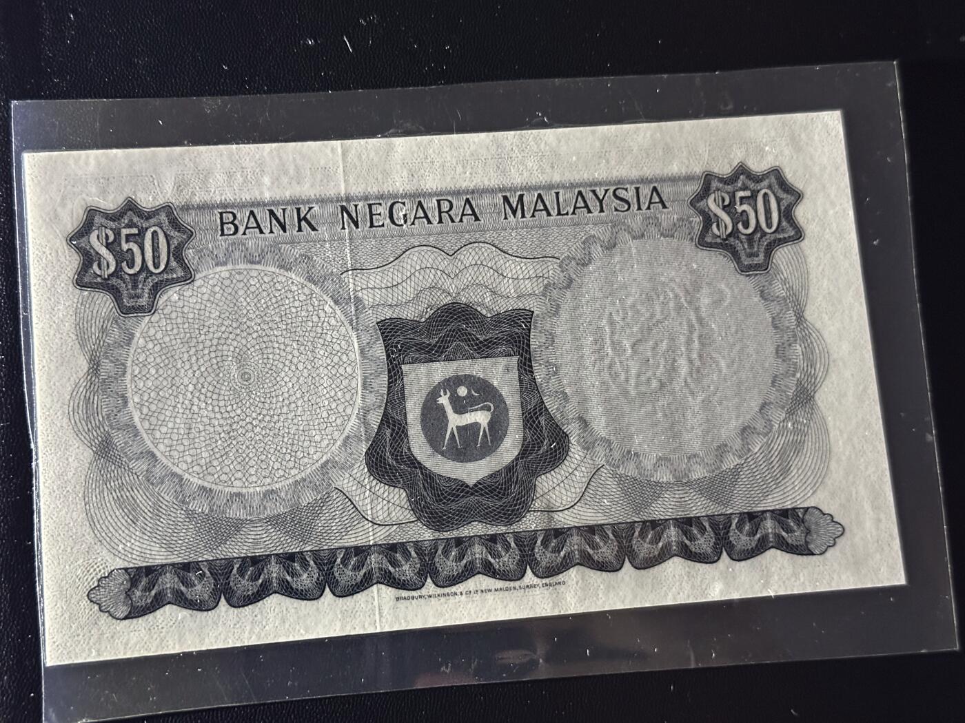 《外钞收藏家》第六百零七期（畅拍场）（本平台长期征集拍品、欢迎藏友们联系合作） 马来西亚50林吉特 BWC版 塑封了 品相如图