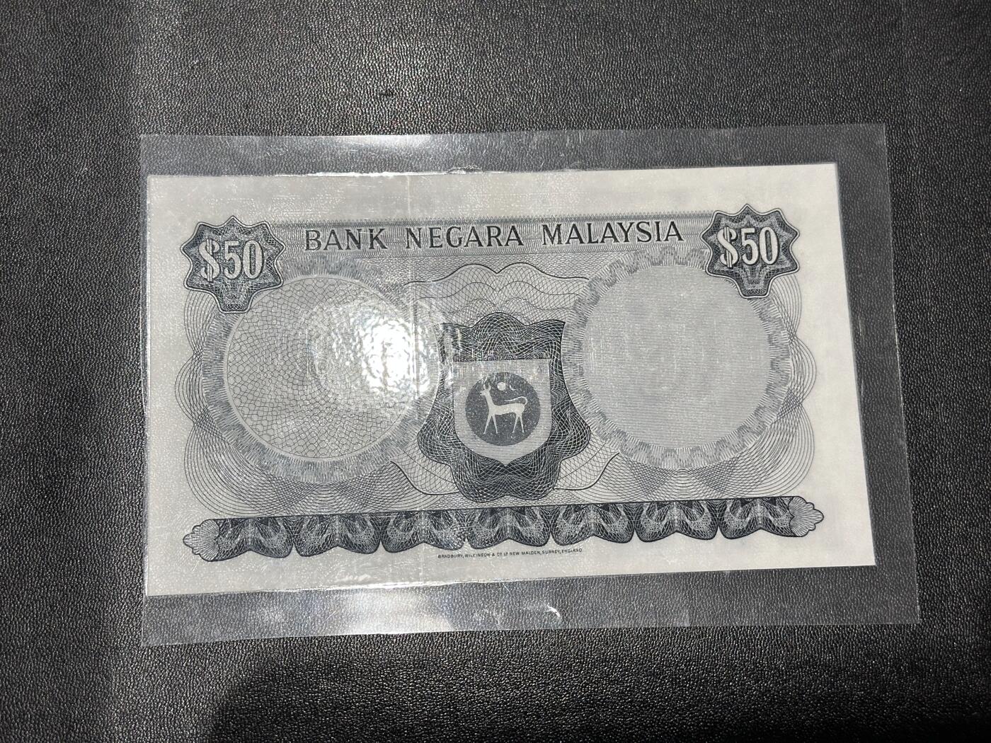 《外钞收藏家》第六百零七期（畅拍场）（本平台长期征集拍品、欢迎藏友们联系合作） 马来西亚50林吉特 BWC版 塑封了 品相如图
