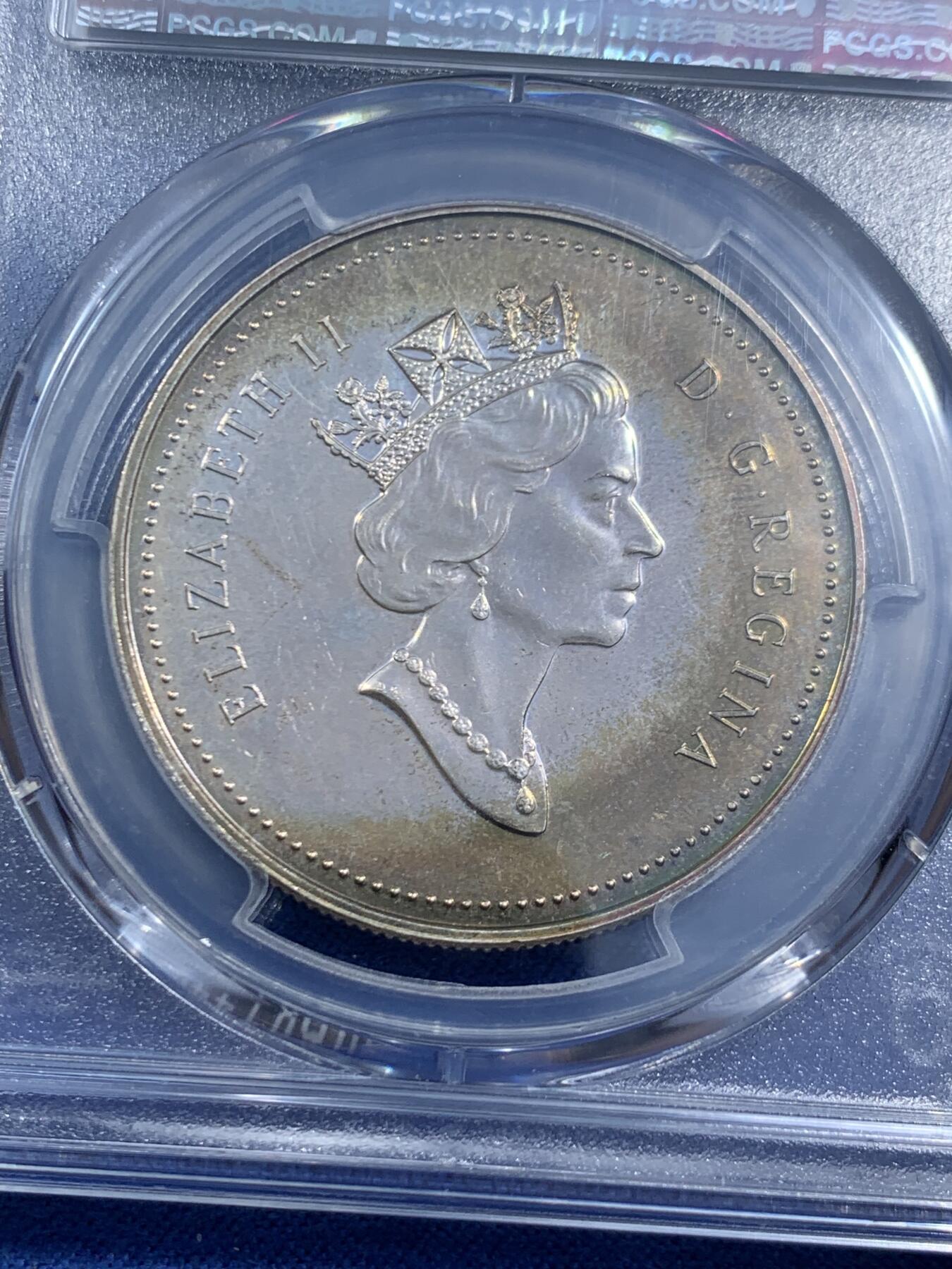 《竞宝斋》第464场 周日，周一，周二，3场连拍 （全场包邮）欢迎送拍 PCGS SP64 加拿大2000年发现之旅纪念银币，25g，900高银，sp特殊工艺非普制币可比，原拆送评，极致炫彩包浆导致压分