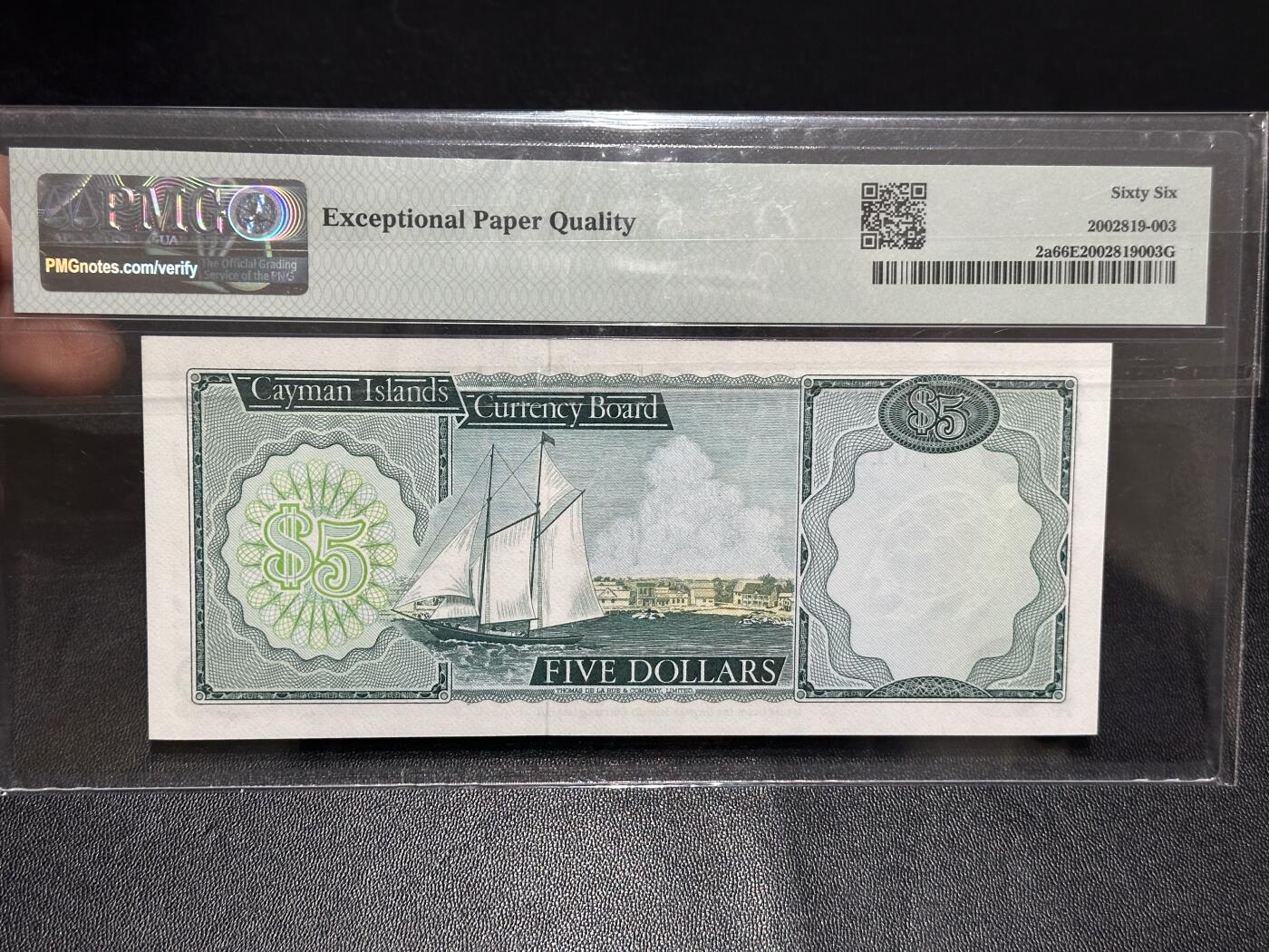 《外钞收藏家》第六百零七期（畅拍场）（本平台长期征集拍品、欢迎藏友们联系合作） 1971年开曼群岛5元 精美女王 PMG66 A/1冠 朦胧号