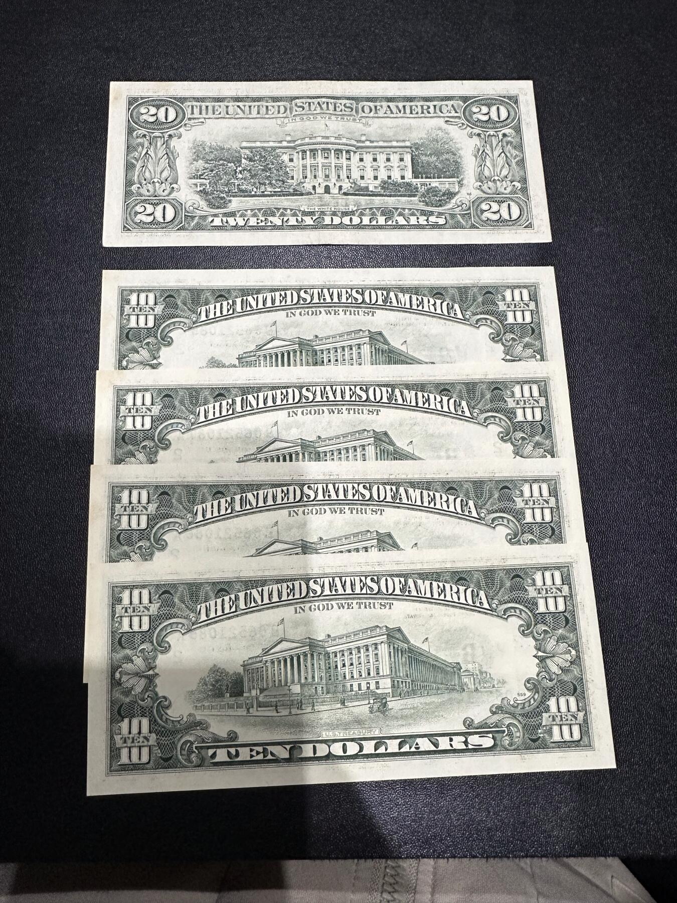 《外钞收藏家》第六百零八期（精选场）（本平台长期征集拍品、欢迎藏友们联系合作） 1993年美国小头版10美元 4连号无折但有黄斑加1988年20美元流通品一起