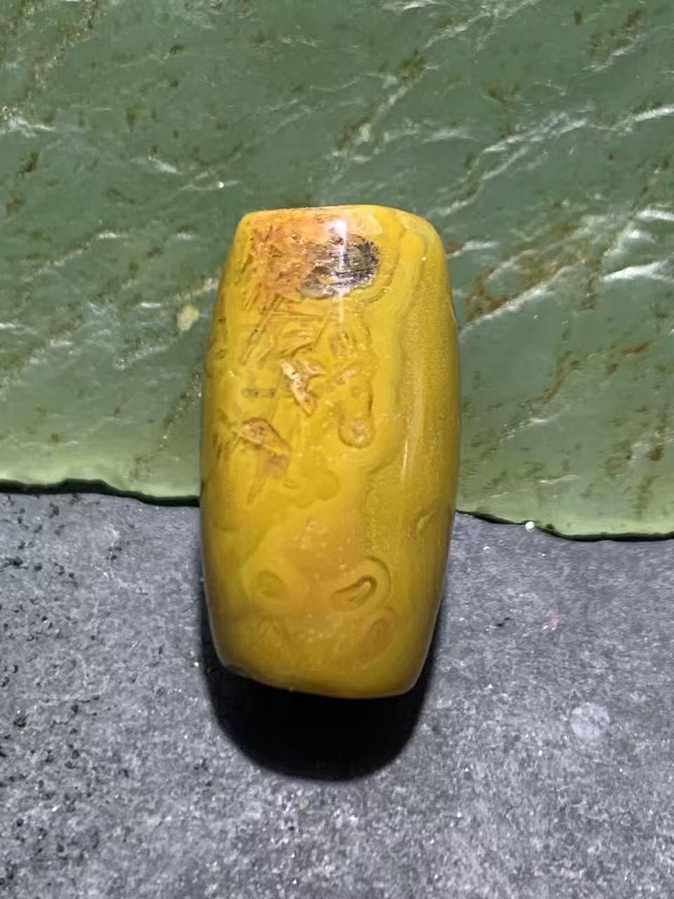 冰飘草花纹战国红玛瑙通货桶珠一颗！